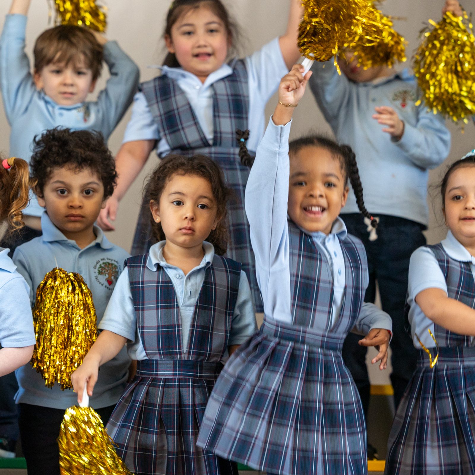 Pre-kindergarten students at Sacred Heart School in Washington, D.C., cheer for their teacher, Patricia Gonzalez, at a surprise school assembly on April 22, when it was announced that she is a 2024 Golden Apple Award-winning teacher in The Roman Catholic Archdiocese of Washington. (Catholic Standard photo by Mihoko Owada)