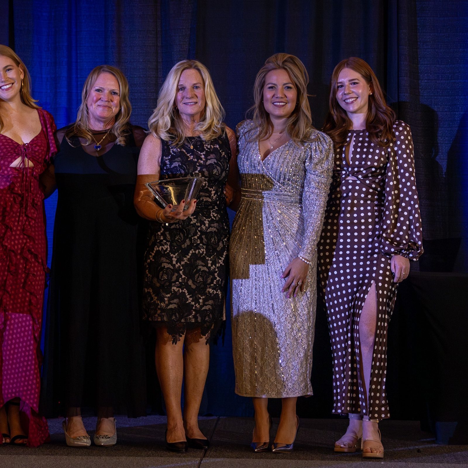 At the Catholic Business Network of Montgomery County’s Gala on Nov 22, Tim Tehan was the posthumous recipient of the Paul G. Zurkowski Founder’s Award. Accepting the award for him were his wife Lisa Tehan, at center, joined by their daughters Maggie and Katie, shown at the far left and the far right. Also pictured in the above photo are Susan Apgood, second from left, the emcee at the gala; and Greta Vento, second from right, the president of CBN-MC. (Catholic Standard photo by Mihoko Owada)