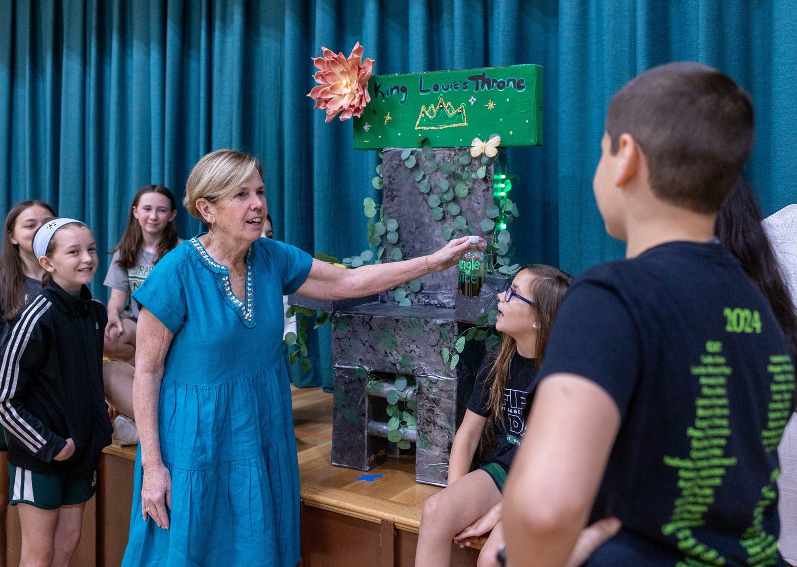During STEM week on June 5 at St. Raphael School in Rockville, retiring principal Teri Dwyer views projects that students made from recyclable materials. (Catholic Standard photo by Mihoko Owada)