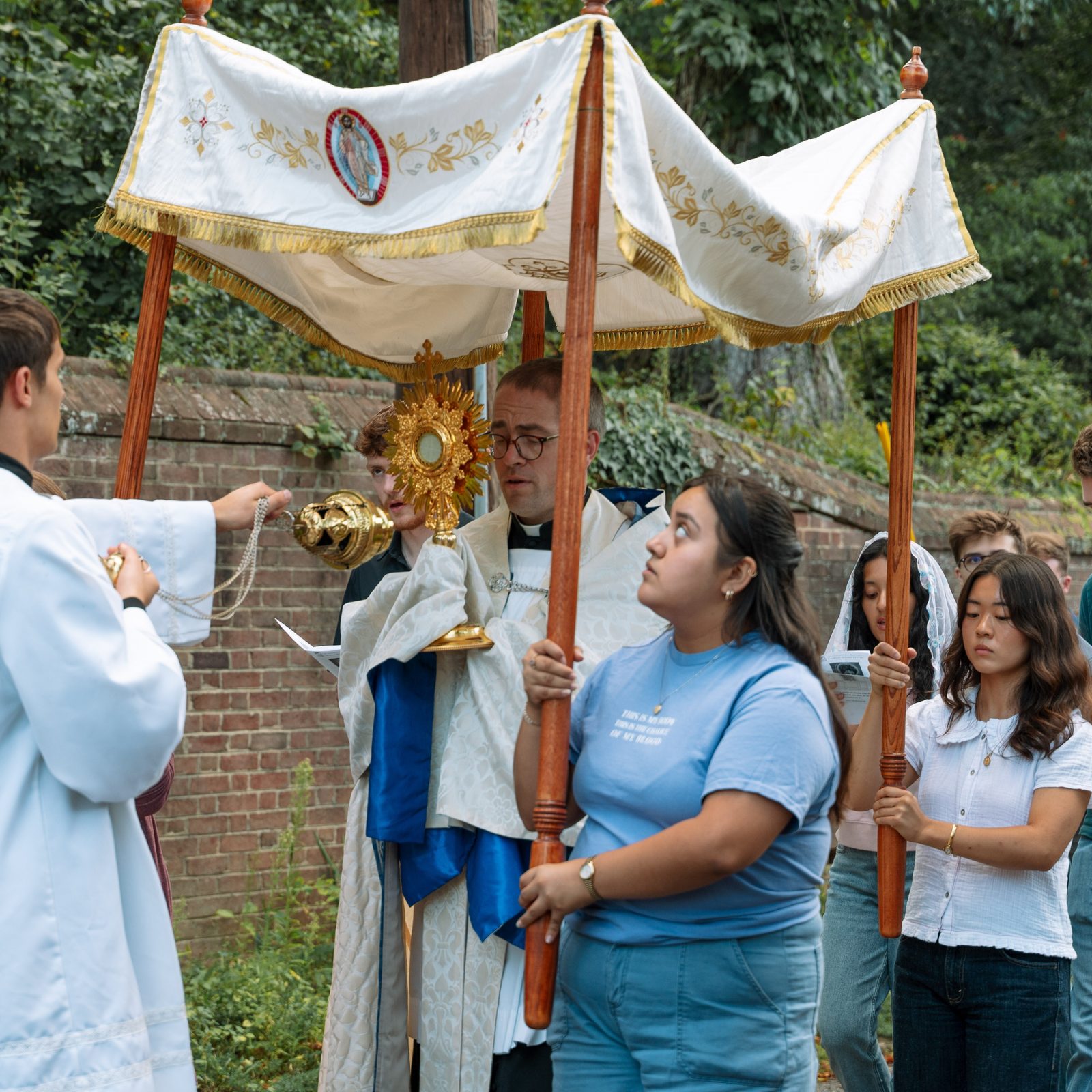Father Conrad Murphy, the chaplain at the Catholic Student Center at the University of Maryland in College Park, leads a Eucharistic procession joined by students in conjunction with the canonization of St. Carlo Acutis on Sept. 7, 2025. (Catholic Standard photo by Nicole Olea)