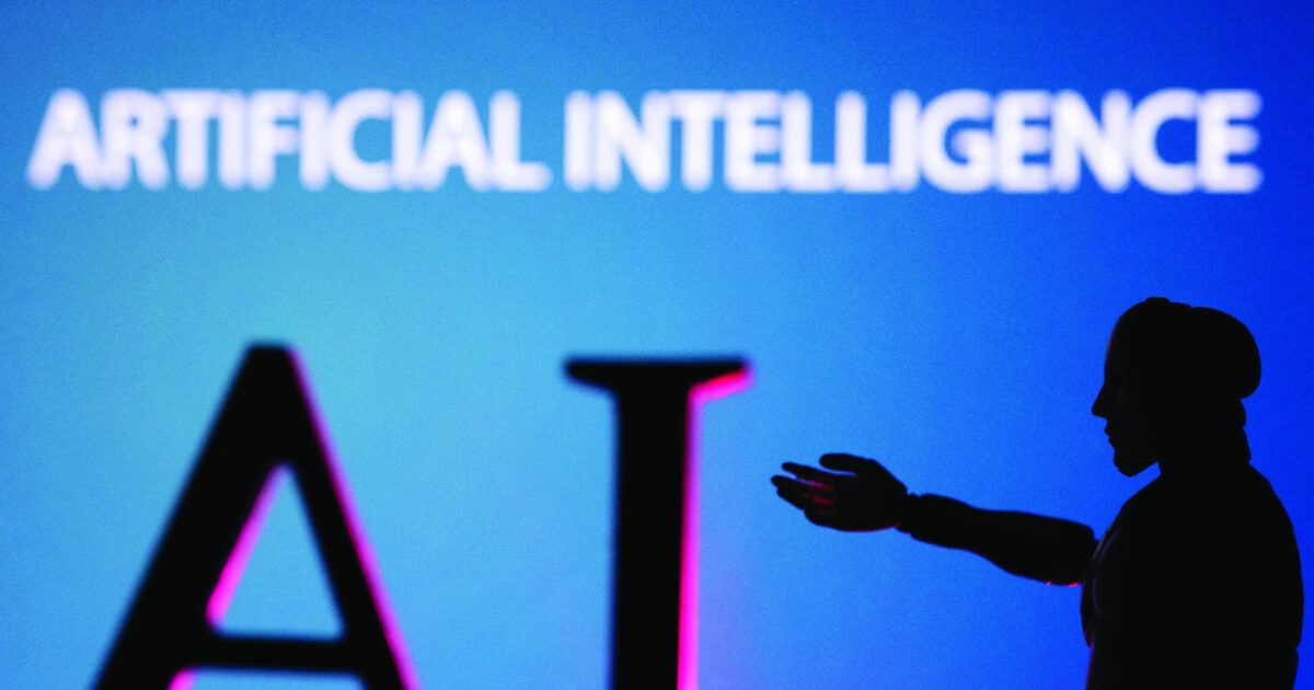 AI (Artificial Intelligence) letters and robot miniature are seen in this Dec. 14, 2023, illustration. (OSV News photo/Dado Ruvic, Reuters)