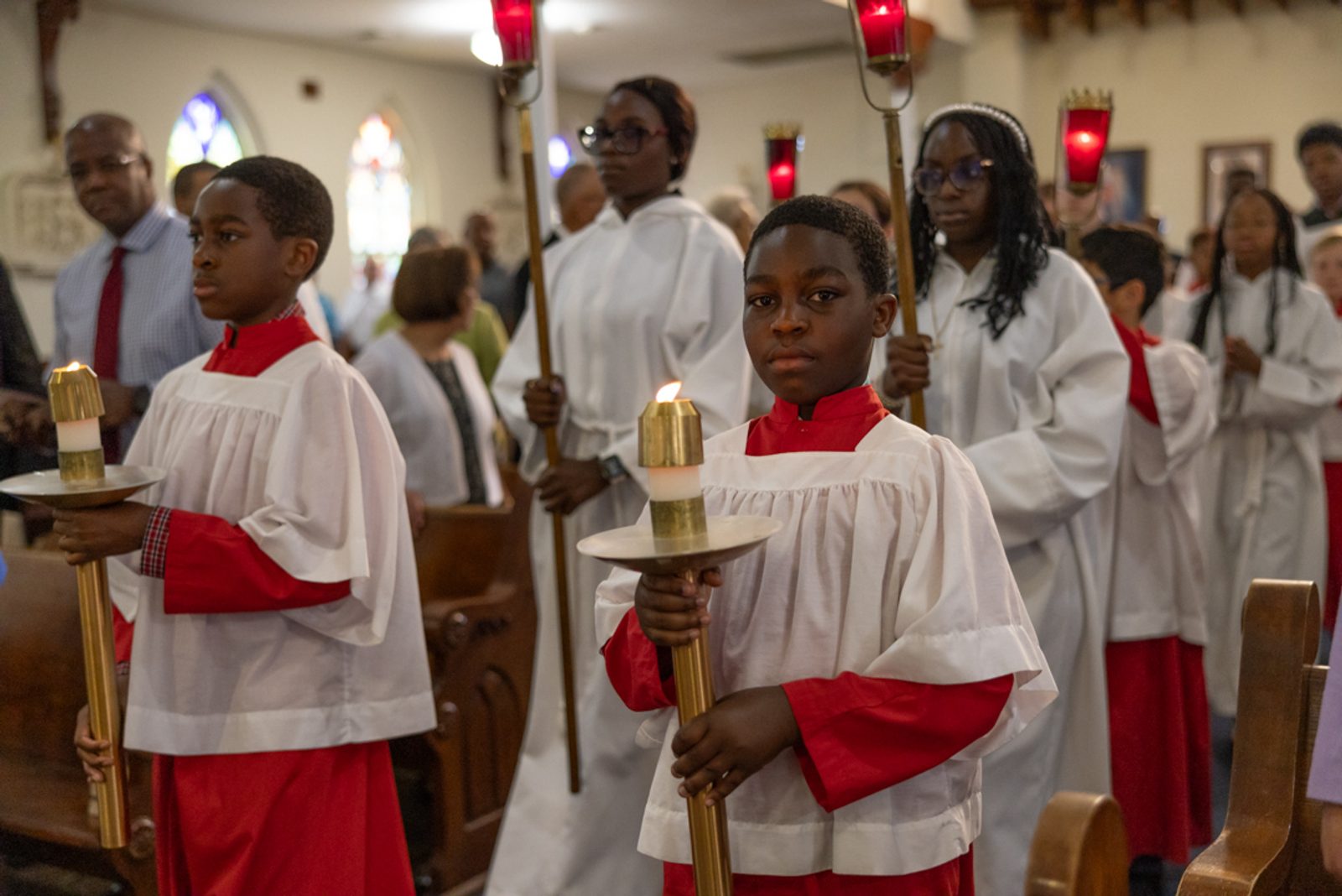 Altar servers help lead the procession to the altar at the beginning of a Mass celebrating the 200th anniversary of St. Mary of the Assumption Parish in Upper Marlboro, Maryland, on June 2, 2024. (Catholic Standard photo by Andrew Biraj)
