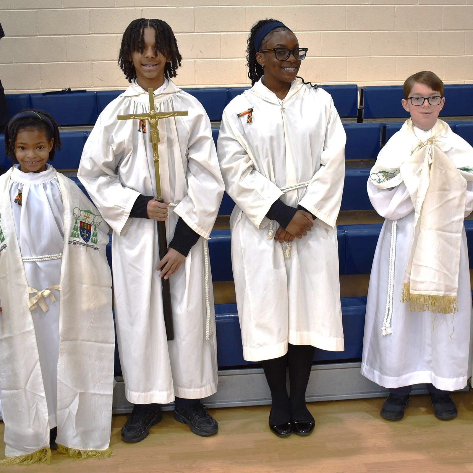 The altar servers for a Mass for Black History Month on Feb. 6 at St. Mary of the Assumption Catholic School in Upper Marlboro included, from left to right, third grader  Kree Thompson, eighth grader Matthew Atkins, eighth grader Megan Akpan, eighth grader Dominic Italiano and sixth grader Elijah Taniform. (Photo by Michelle Dunn from St. Mary of the Assumption Catholic School)