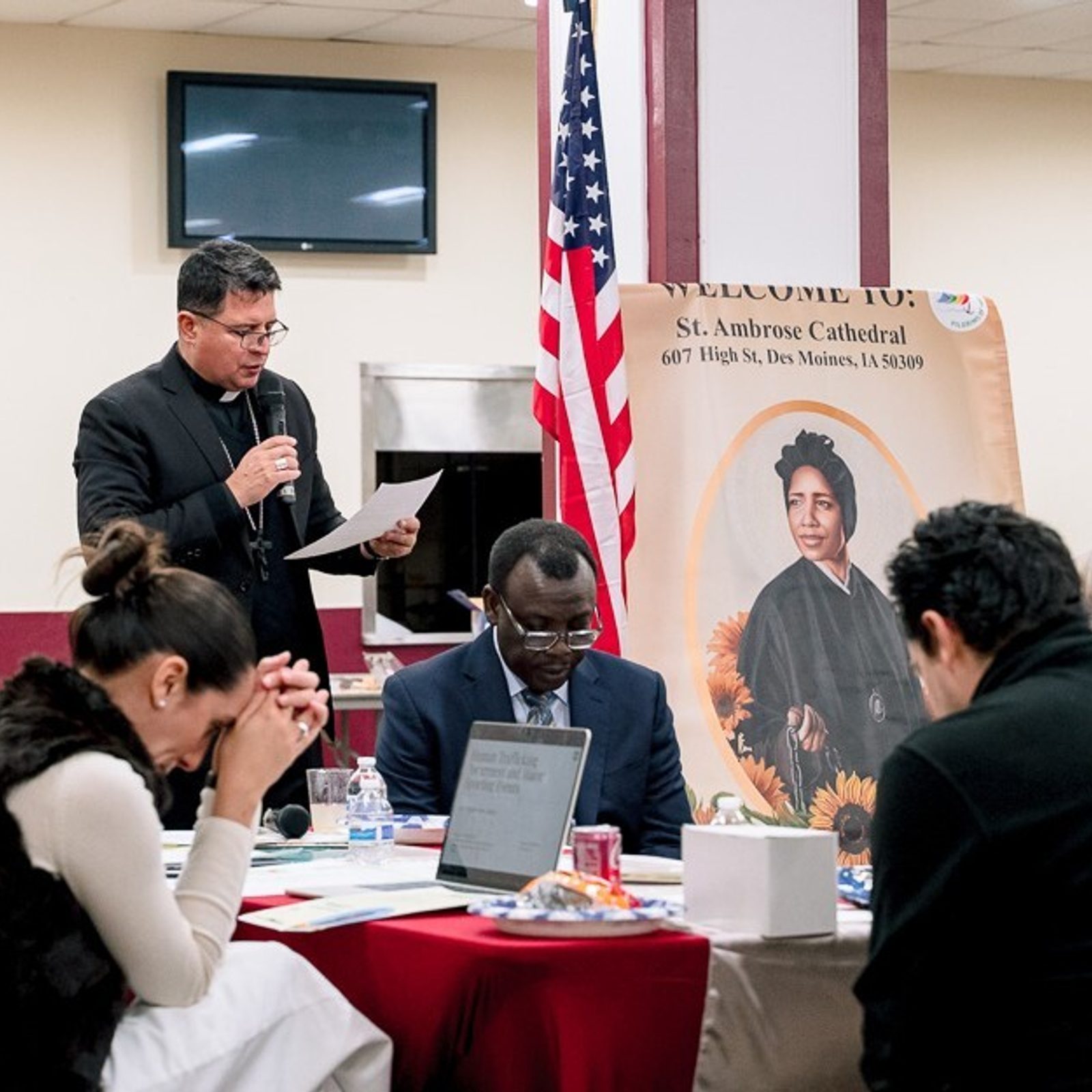 Washington Auxiliary Bishop Evelio Menjivar was among speakers reflecting on the World Day of Prayer and Awareness Against Human Trafficking on Feb. 7 at the parish hall of St. Mary’s Catholic Church in Landover Hills, Maryland. The discussion followed a Mass marking the feast day of St. Josephine Bakhita, who is depicted in the banner and who is the patron saint of victims of slavery and human trafficking. (Catholic Standard photo by Nicole Olea)