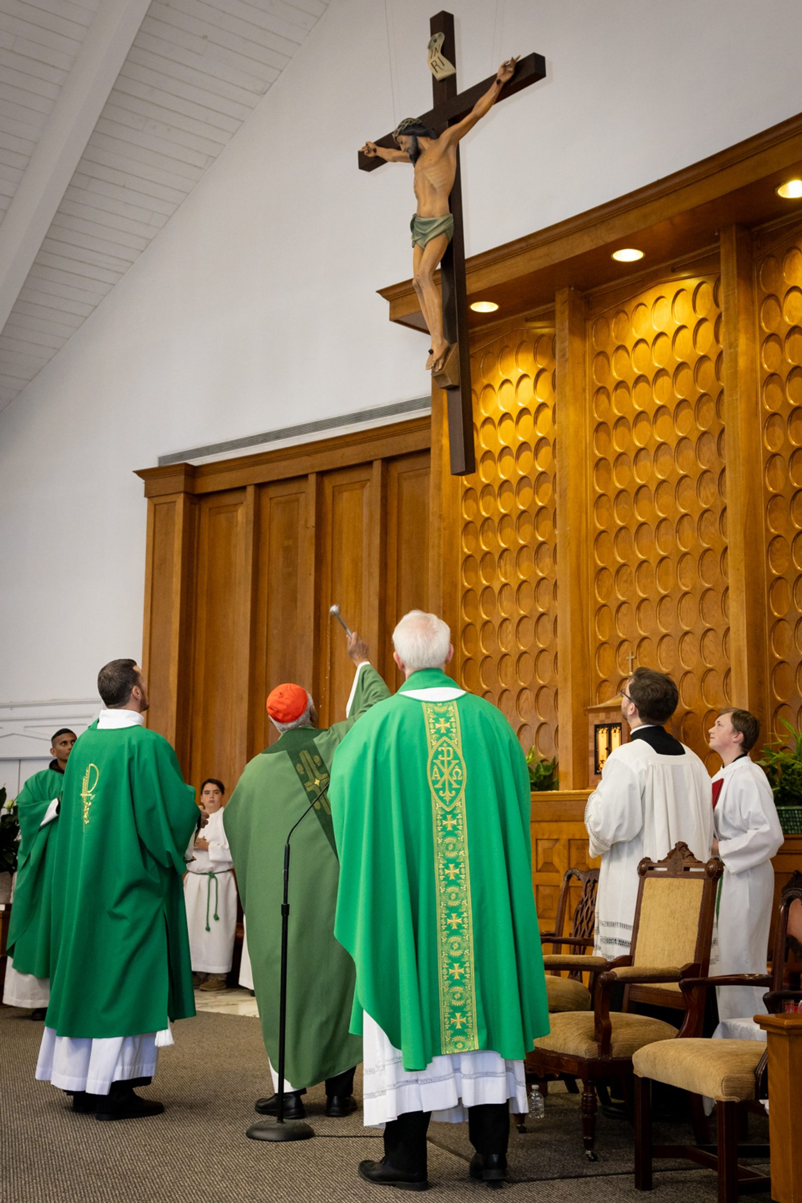 During a Mass on Nov. 10, 2024, Washington Cardinal Wilton Gregory at center blesses the new crucifix at St. John the Baptist Church in Silver Spring, Maryland. (Catholic Standard photo by Christopher Newkumet)