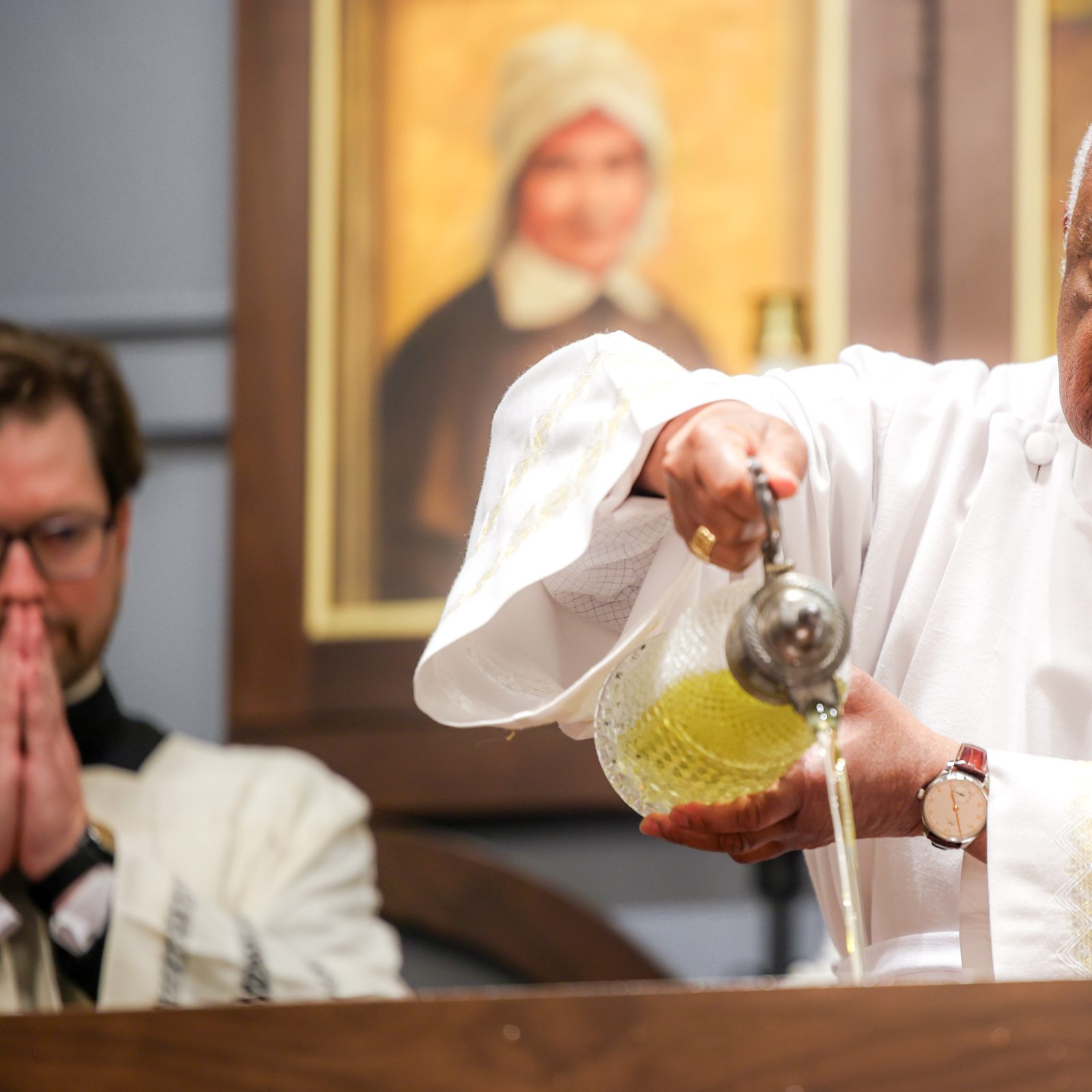 During a June 5, 2024 Mass at St. Mary’s Ryken High School in Leonardtown, where Cardinal Gregory blessed the new altar at the school’s renovated Chapel of Charity, the cardinal anoints the altar with chrism. At left is Father Kevin Regan, the cardinal’s priest secretary. (Photo by HD Photography for St. Mary’s Ryken High School)