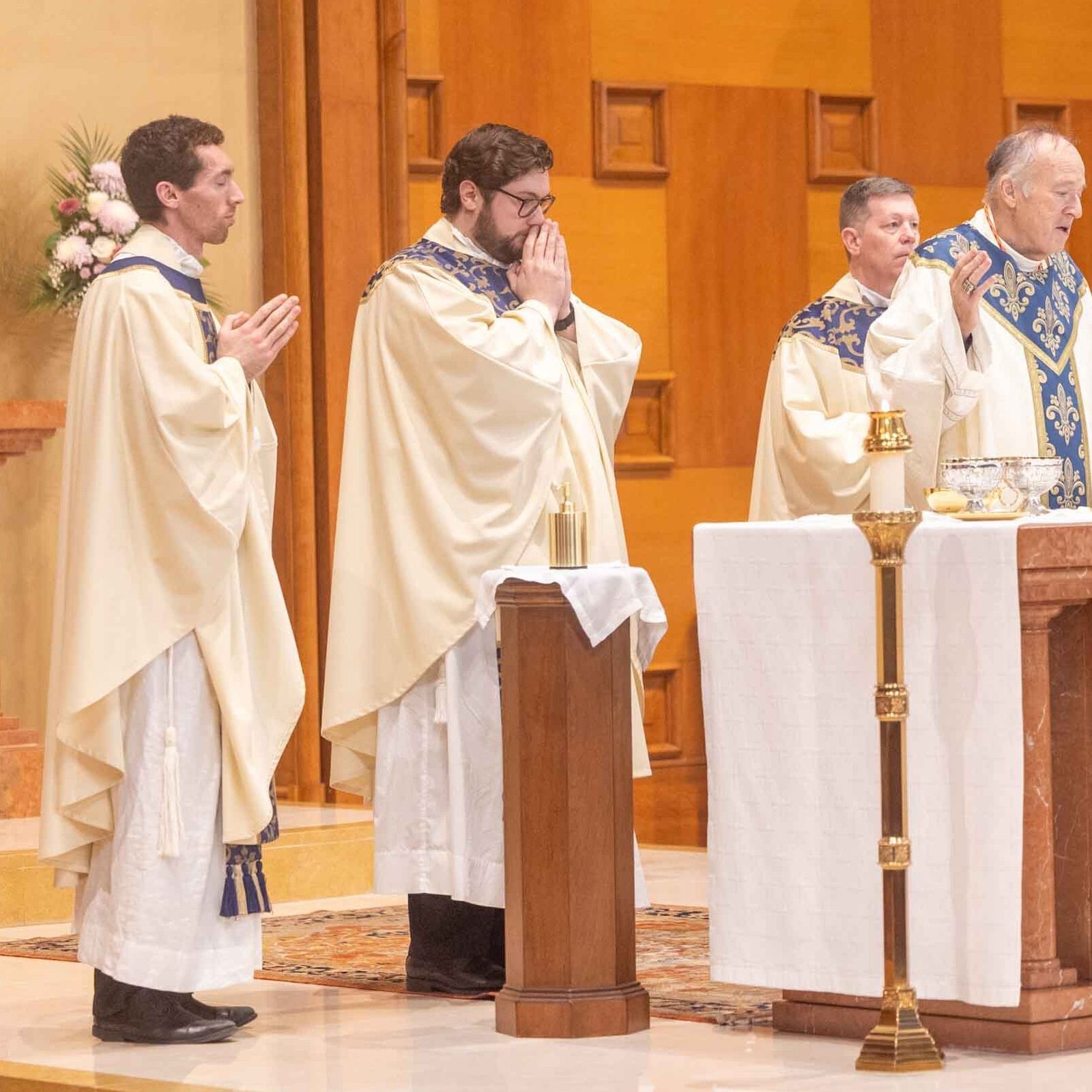 Washington Cardinal Robert W. McElroy at center celebrates a Feb. 11 Mass at Our Lady of Lourdes Church in Bethesda that marked the parish’s 100th anniversary. From left to right are Father Kyle Poje, a priest from the Archdiocese of Seattle who is in residence at the parish while he is studying canon law; Father Dylan Prentice, a parochial vicar there; Father Rob Walsh, the pastor of Our Lady of Lourdes Parish; Cardinal McElroy; and Father Thomas Robertson, the cardinal’s priest secretary. (Catholic Standard photo by Mihoko Owada)