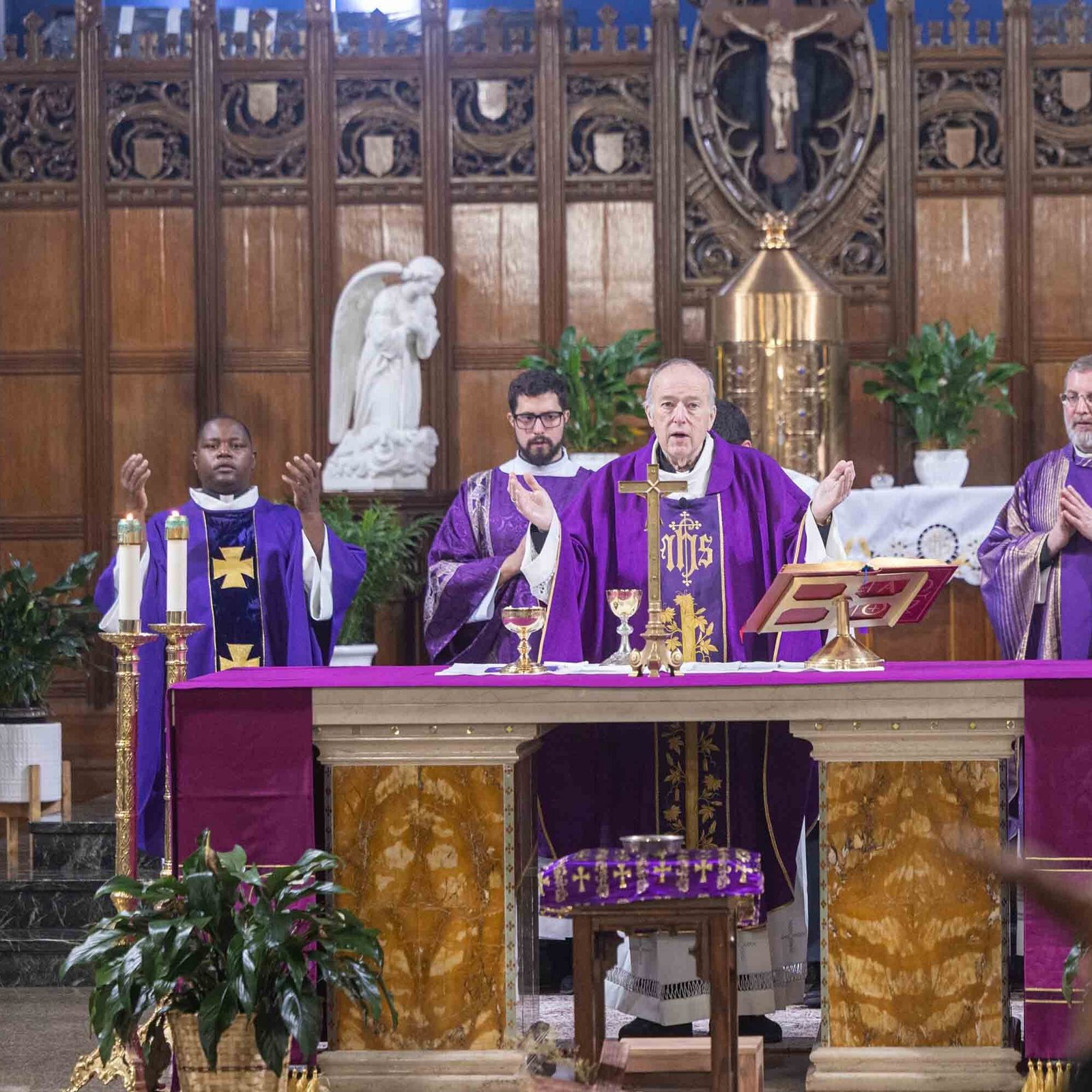 Cardinal Robert W. McElroy, the archbishop of Washington (at center), serves as the main celebrant at the 125th anniversary Mass for Nativity Parish in Washington on Feb. 22, 2026. From left to right are Father Yohana Shija Masalu, a priest from Tanzania who is in residence at Nativity while he is studying at The Catholic University of America; Deacon Federico Mariano, a seminarian for the archdiocese from Argentina who is serving at the parish; Cardinal McElroy; Father Pawel Sass, a native of Poland who has served as Nativity’s pastor for the past six years; and Father Emanuel Lucero, the parish’s parochial vicar who is from Argentina. (Catholic Standard photo by Mihoko Owada)