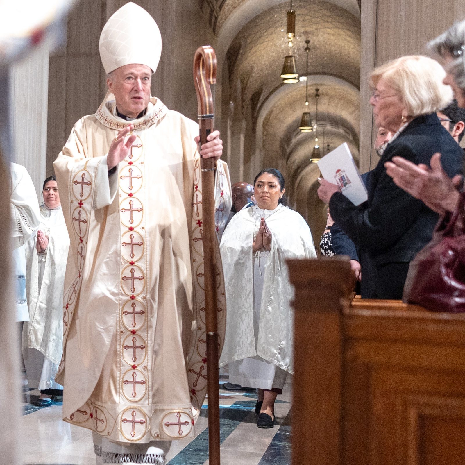 Cardinal Robert McElroy blesses the faithful at the Basilica of the National Shrine of the Immaculate Conception as he processes from the altar following his Solemn Mass of Installation on March 11, 2025 as the new archbishop of Washington. (Catholic Standard photo by Mihoko Owada)