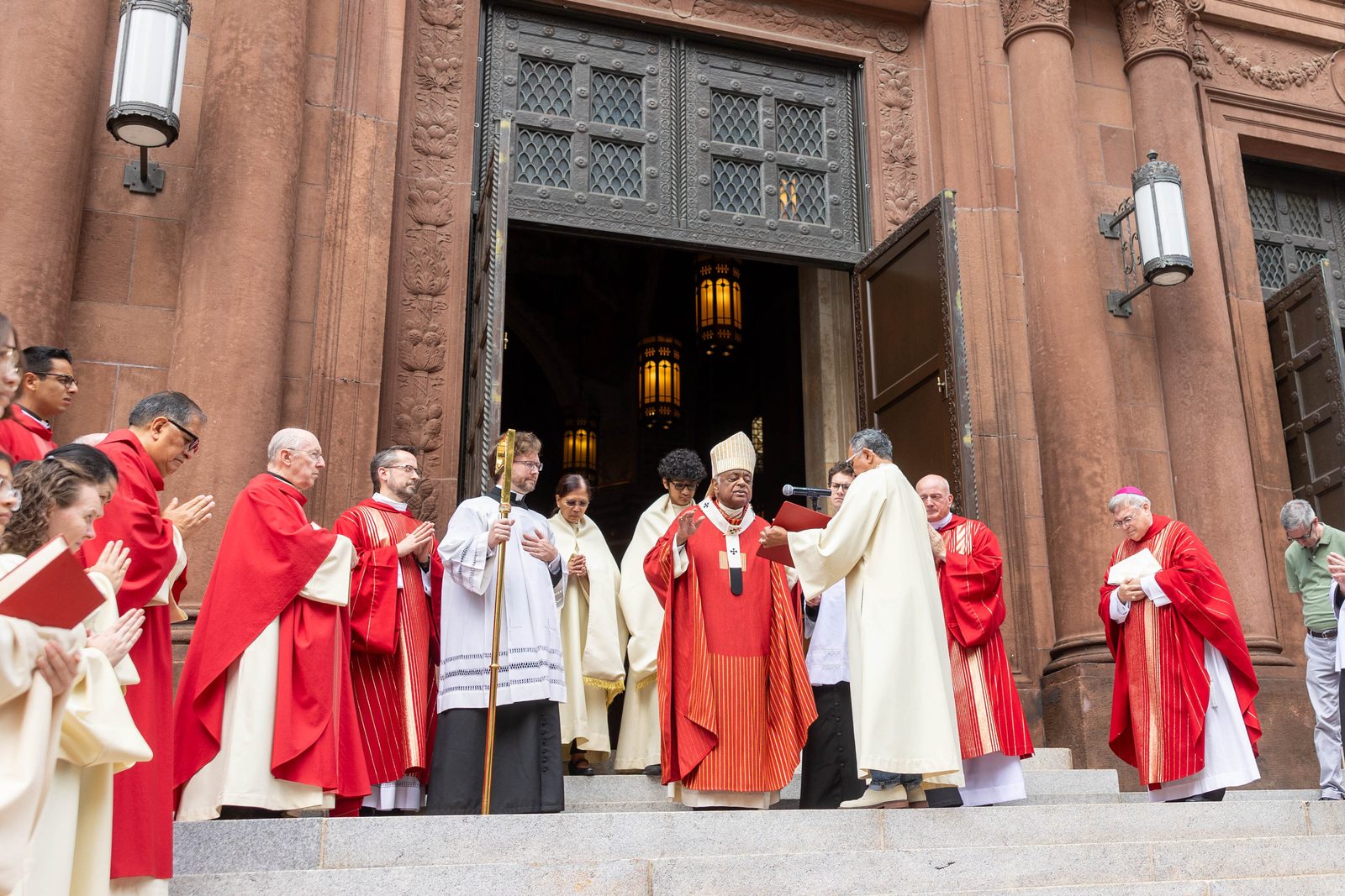 After celebrating a Mass on Sept. 21, 2024 at St. Matthew’s Cathedral in Washington marking the centennial of the Nuns of the Battlefield Monument located across the street, Cardinal Wilton Gregory offers prayers rededicating the monument. In the photo below, members of the Ladies Ancient Order of Hibernians, an Irish American Catholic group that led the drive for the monument 100 years ago, attend the rededication ceremony. To mark the monument’s 100th anniversary, the Ladies Ancient Order of Hibernians led an effort for a new wayside marker offering an overview of the monument that was dedicated after the anniversary Mass. (Catholic Standard photos by Mihoko Owada)