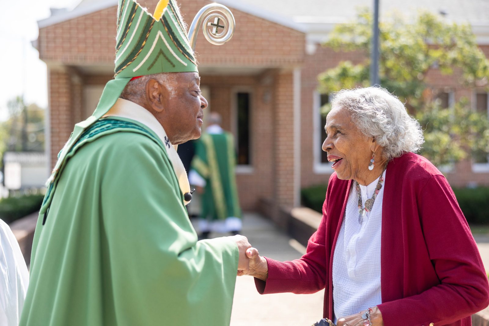Cardinal Wilton Gregory greets a woman after a Sept. 15, 2024 Mass marking the 100th anniversary of the Church of the Incarnation in Washington, D.C. (Catholic Standard photo by Mihoko Owada)