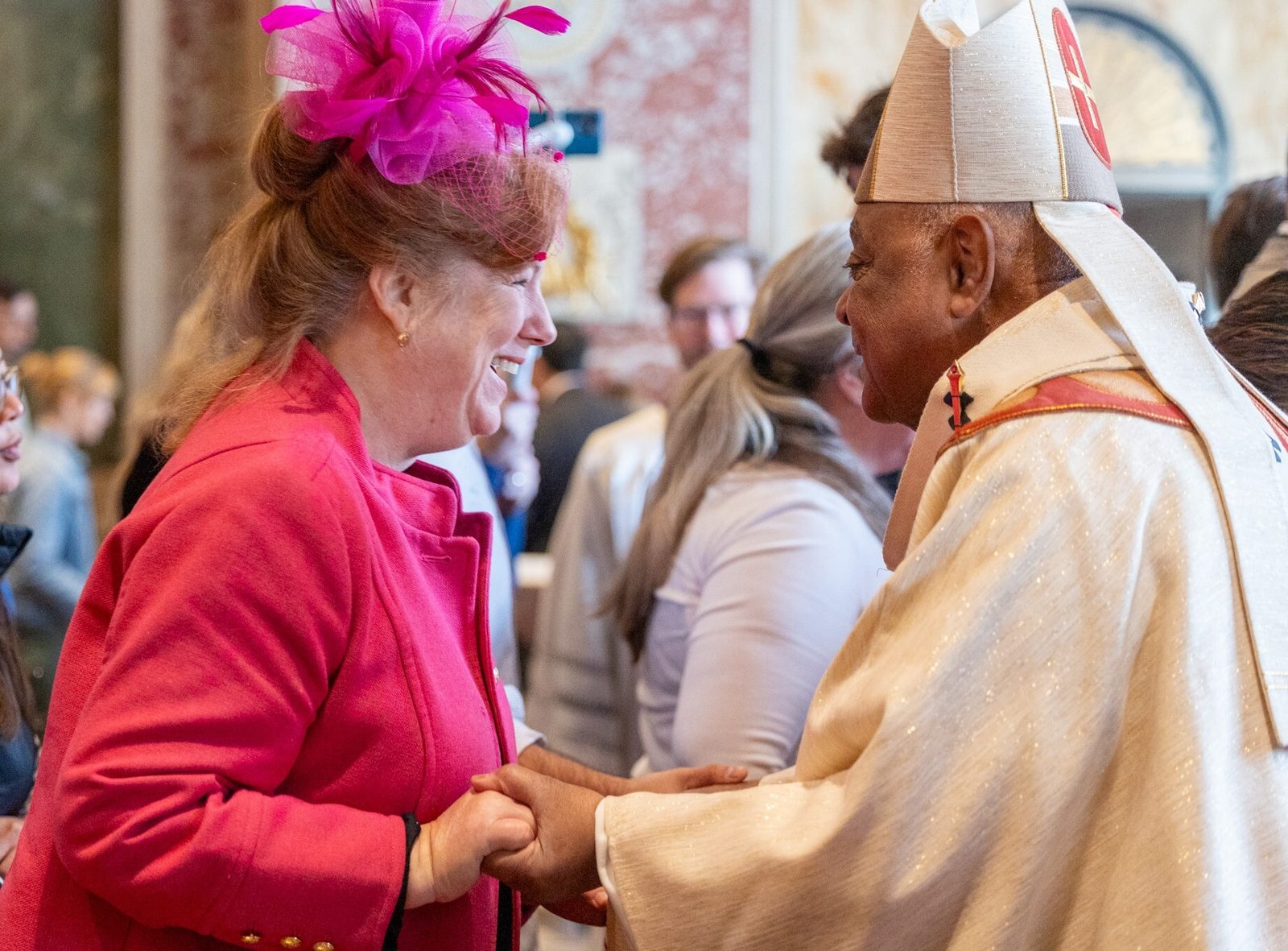 A woman greets Cardinal Wilton Gregory after an Easter Sunday Mass on March 31 at St. Matthew’s Cathedral in Washington, D.C. (Catholic Standard photo by Mihoko Owada)