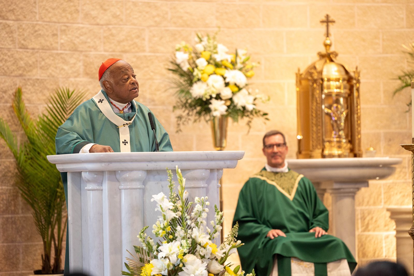 Cardinal Wilton Gregory gives his homily while celebrating a Mass on June 30, 2024 marking the 50th anniversary of Mother Seton Parish in Germantown, Maryland. At right is Father Lee Fangmeyer, Mother Seton’s pastor. (Catholic Standard photo by Mihoko Owada)