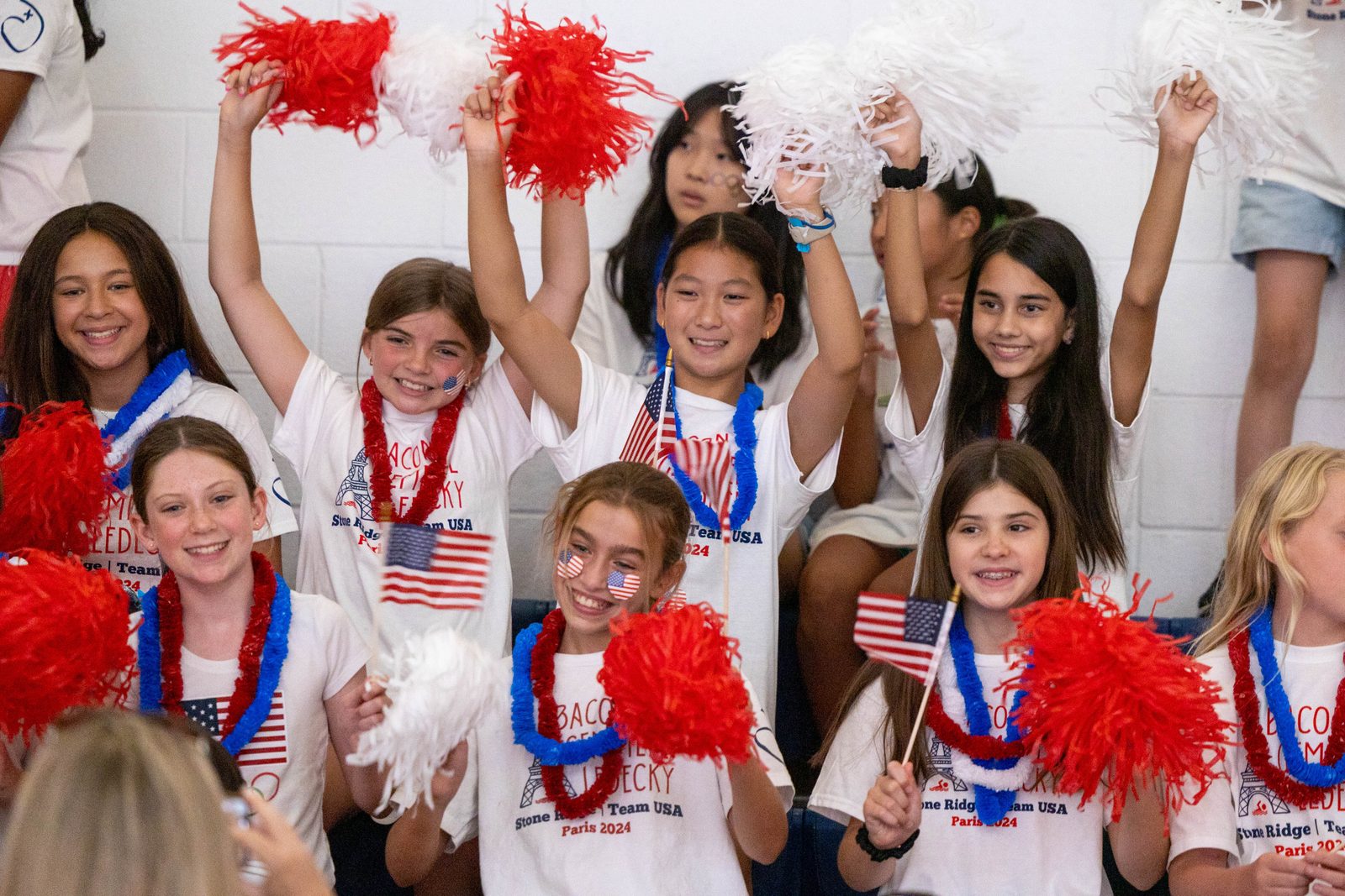 Students at Stone Ridge School of the Sacred Heart in Bethesda, Maryland, cheer at a July 25, 2024 pep rally for three of the school’s graduates – Katie Ledecky (class of 2015), Phoebe Bacon (class of 2020) and Erin Gemmell (class of 2023) – who are members of the U.S. Olympic Swimming Team competing in the Summer Olympics in Paris. The pep rally was held on the day before the opening ceremony at the Olympics. (Catholic Standard photo by Mihoko Owada)