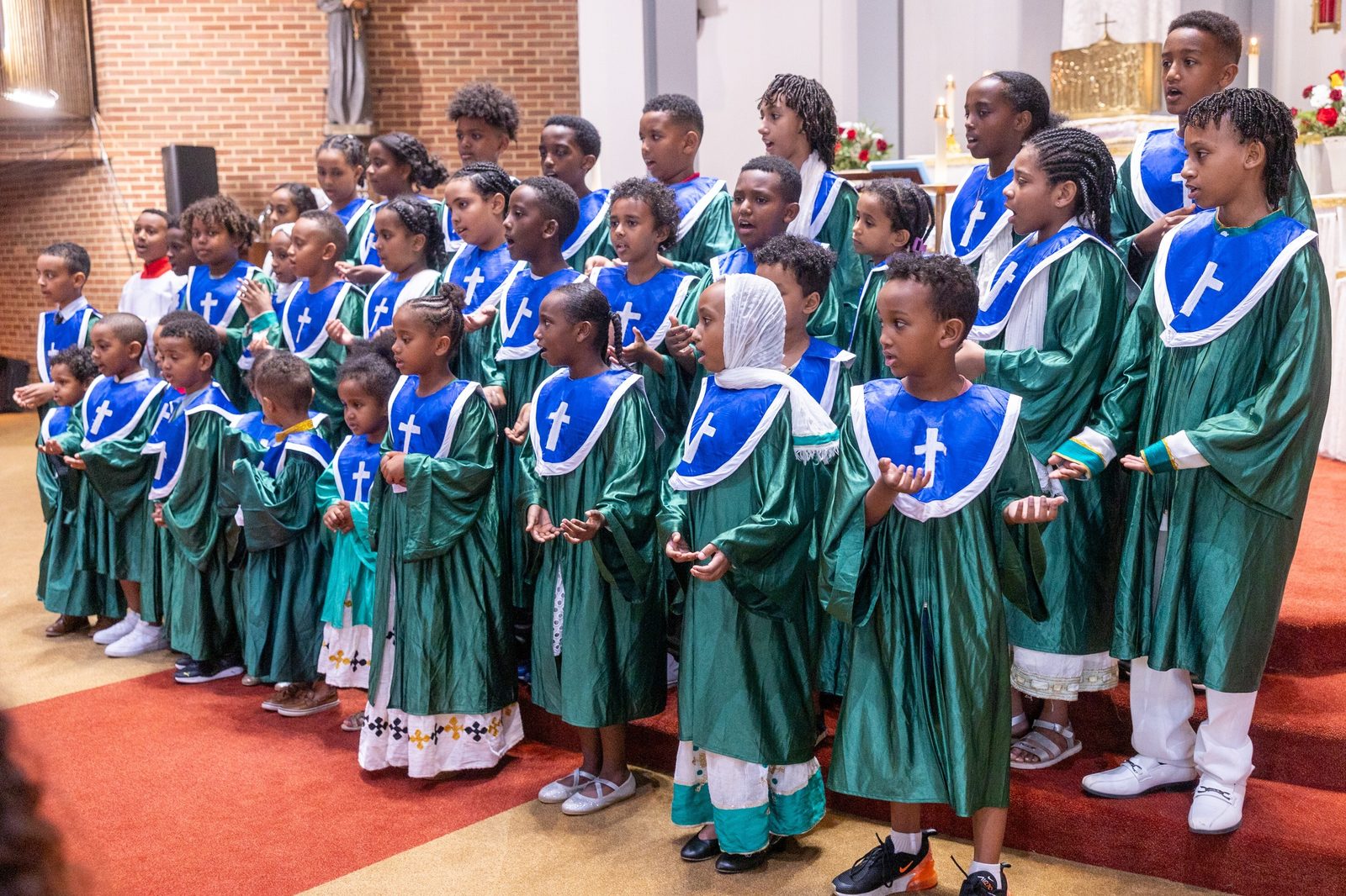 Children’s choir members of Kidane-Mehret Parish for Ethiopian Catholics sing during a Mass on Aug. 24, 2025 at Holy Spirit Church in Forestville, Maryland, their new parish home. (Catholic Standard photo by Mihoko Owada)