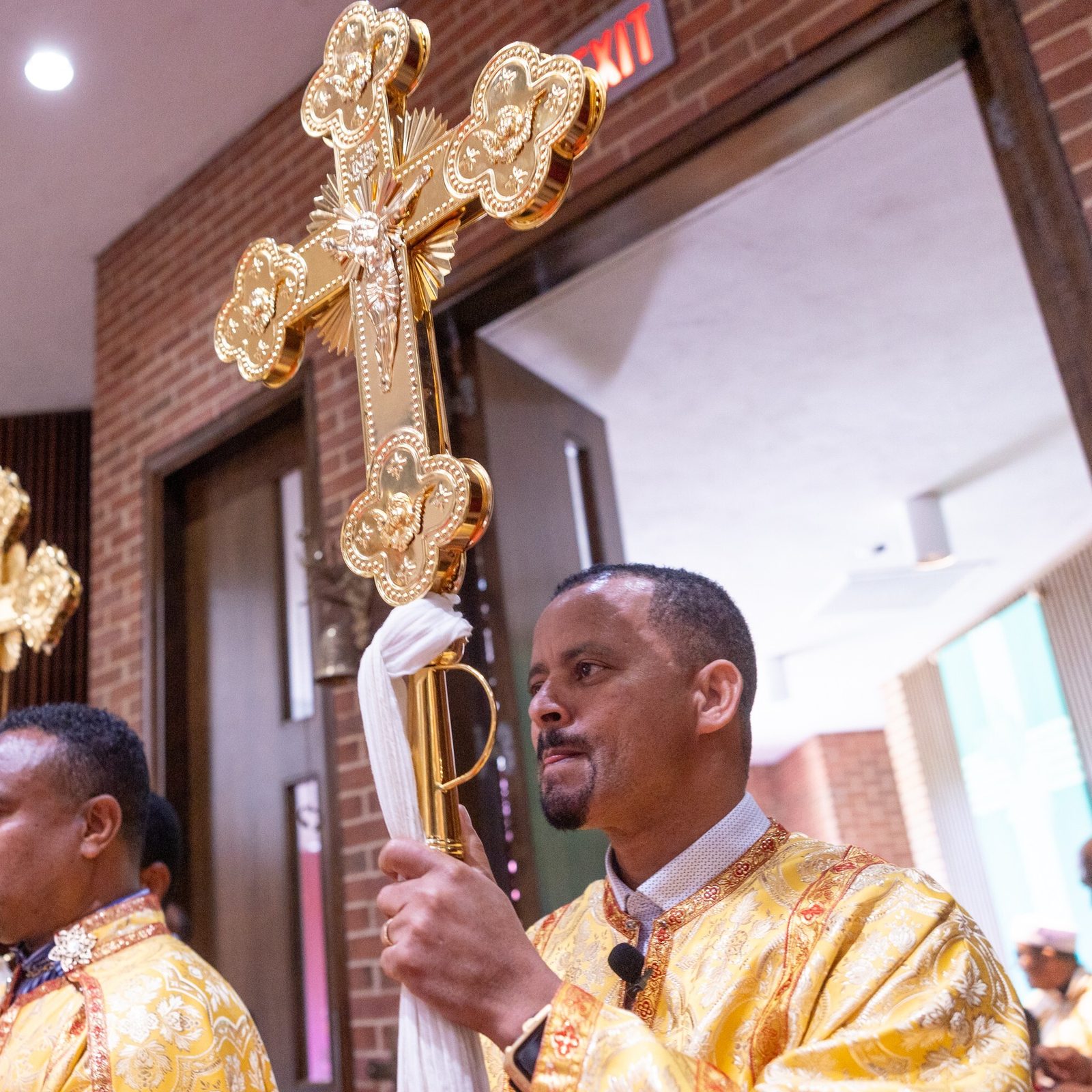 Cross bearers prepare to join the opening procession for a Mass on Aug. 24, 2025 at Holy Spirit Church in Forestville, Maryland, for the Kidane-Mehret Parish for Ethiopian Catholics in The Roman Catholic Archdiocese of Washington. The Mass marked the feast day of the Assumption of the Blessed Virgin Mary and also marked Holy Spirit Church being the new home for that community. (Catholic Standard photo by Mihoko Owada)
