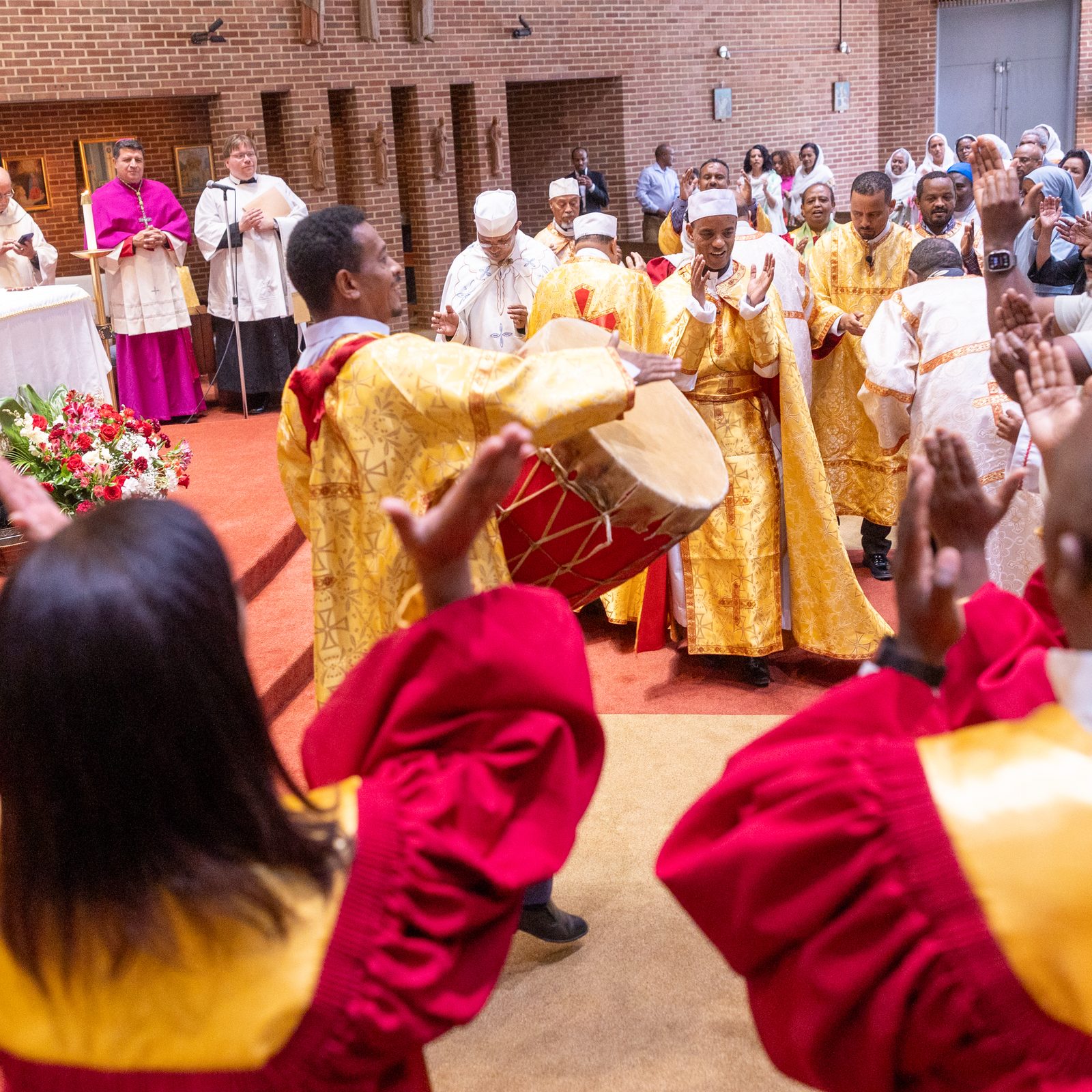 With drumming, singing and dancing, members of Kidane-Mehret Parish for Ethiopian Catholics in the Archdiocese of Washington celebrate at the end of a Mass on Aug. 24, 2025 at Holy Spirit Church in Forestville, Maryland that marked the feast day of the Assumption of the Blessed Virgin Mary and also marked Holy Spirit Church being the new home for that community. (Catholic Standard photo by Mihoko Owada)