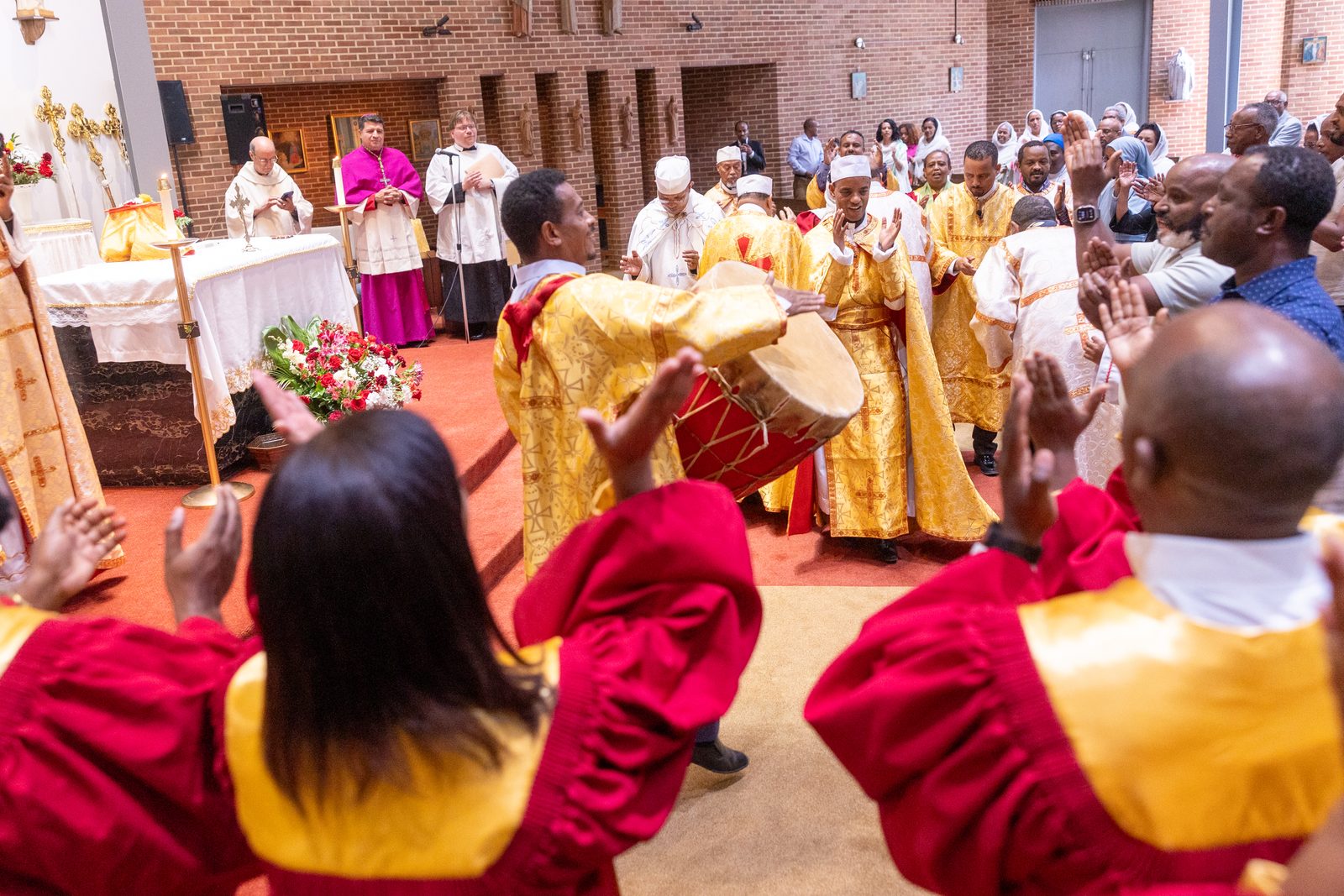 With drumming, singing and dancing, members of Kidane-Mehret Parish for Ethiopian Catholics in the Archdiocese of Washington celebrate at the end of a Mass on Aug. 24, 2025 at Holy Spirit Church in Forestville, Maryland that marked the feast day of the Assumption of the Blessed Virgin Mary and also marked Holy Spirit Church being the new home for that community. (Catholic Standard photo by Mihoko Owada)
