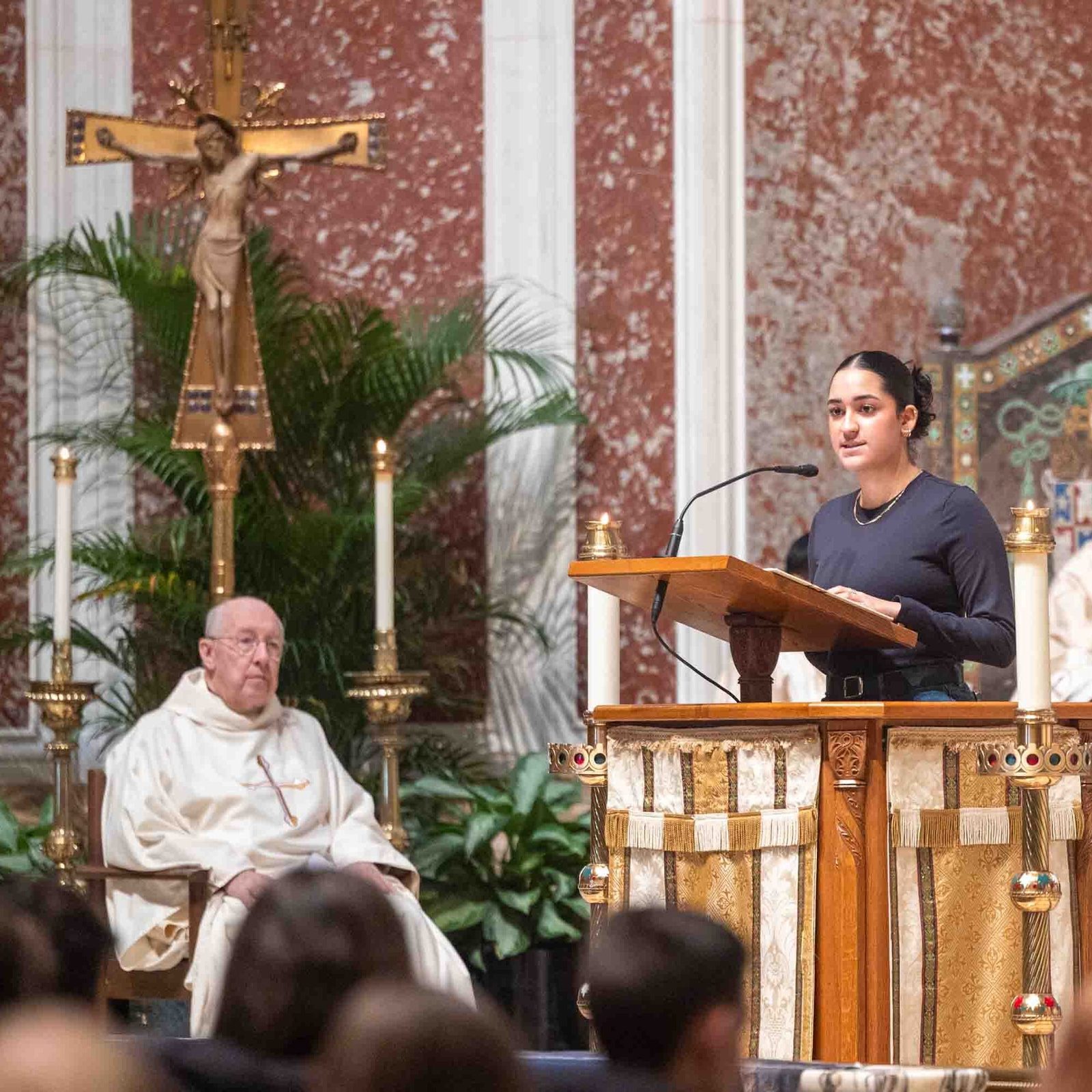 Andrea Patiño, a junior at the Academy of the Holy Cross in Kensington, Maryland, reads the first reading from the Book of Jeremiah during the Youth Mass for Life on Jan. 23, 2026 at the Cathedral of St. Matthew the Apostle in Washington, D.C. At left is Msgr. W. Ronald Jameson, the cathedral’s rector. Before the Mass, she offered a testimony on how she came to understand the dignity and value of human life. (Catholic Standard photo by Mihoko Owada)