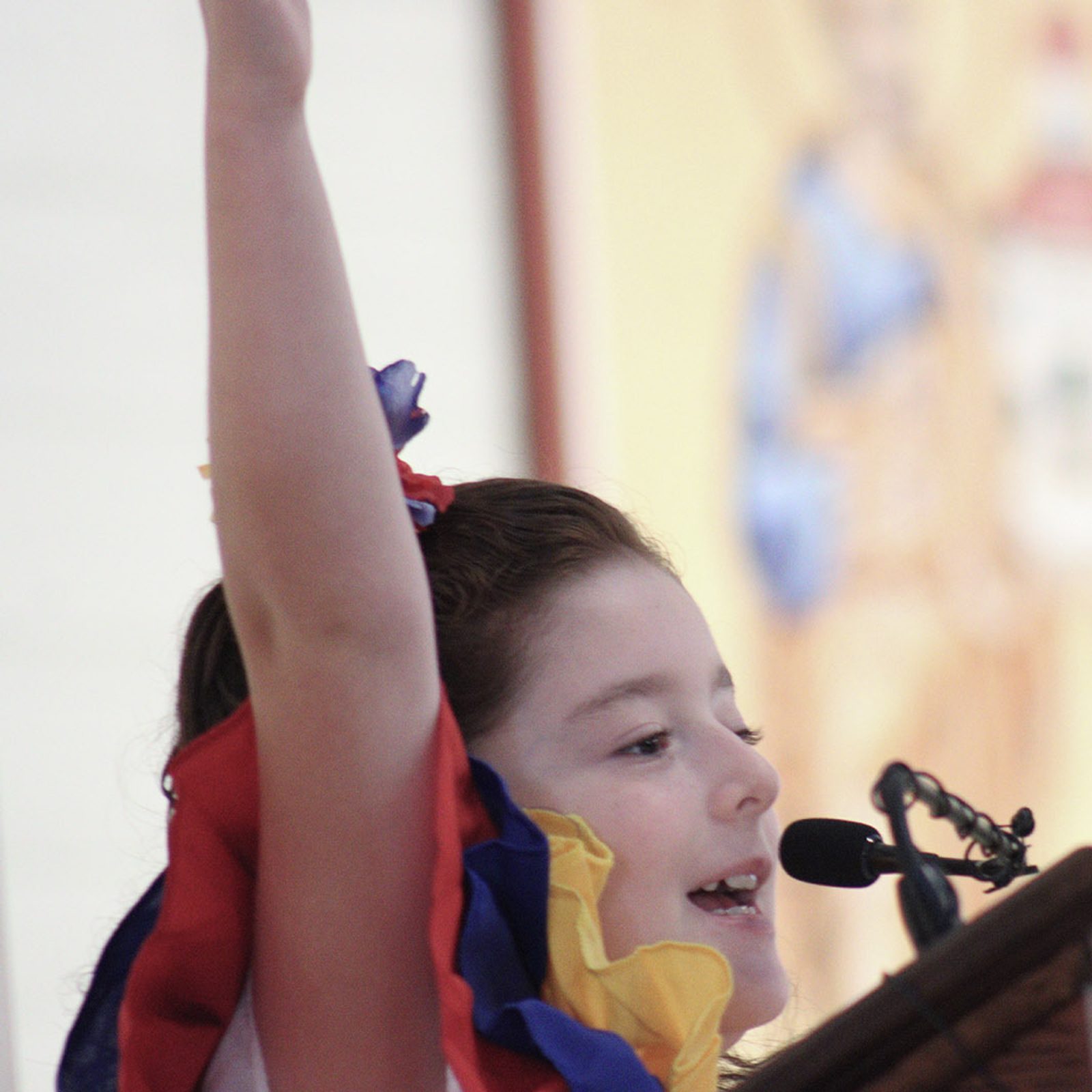 A girl helps lead the responses during an Aug. 18 Mass at the Shrine of St. Jude in Rockville, Maryland. (Catholic Standard photo by Javier Diaz)