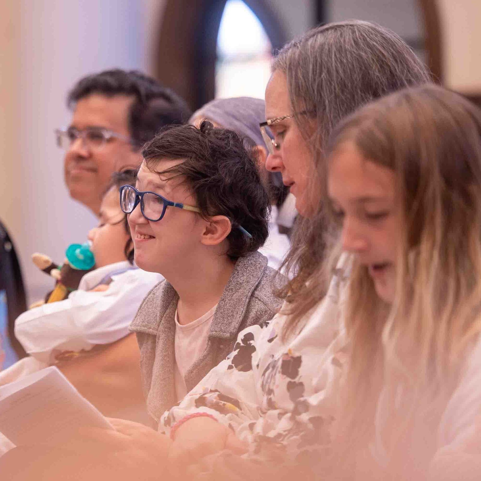 Maria Pannell at center smiles during the White Mass on Oct. 26 at Our Lady of Mercy Church in Potomac. (Catholic Standard photo by Mihoko Owada)