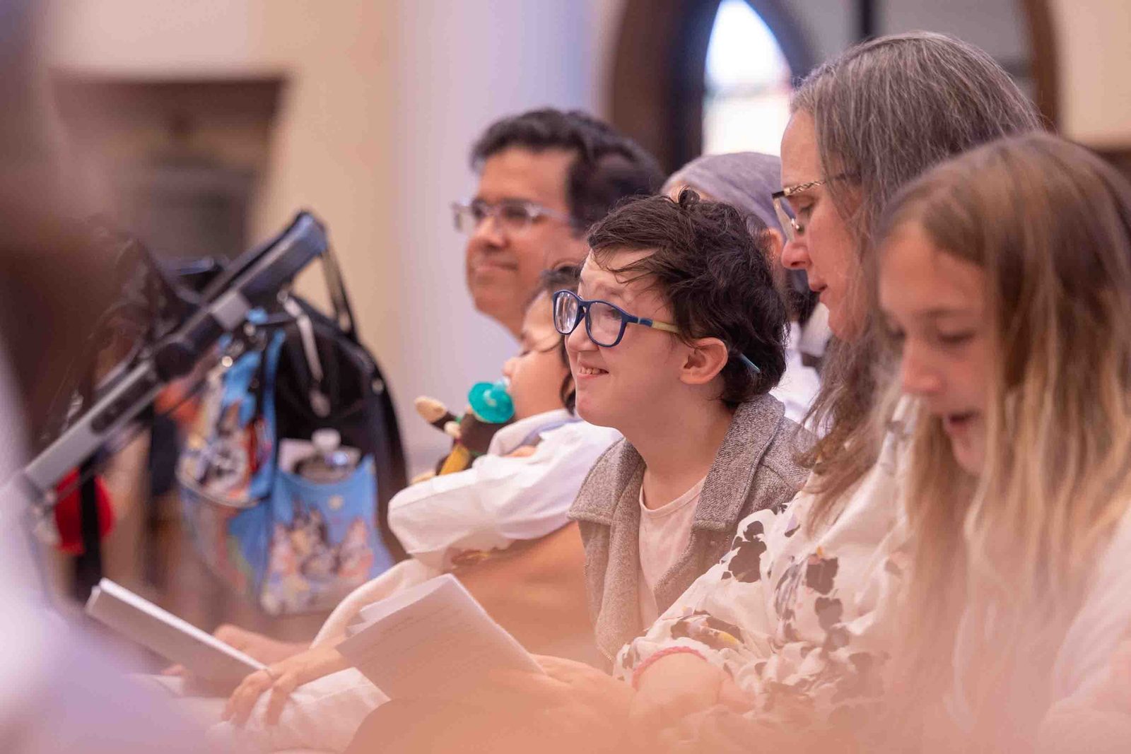 Maria Pannell at center smiles during the White Mass on Oct. 26 at Our Lady of Mercy Church in Potomac. (Catholic Standard photo by Mihoko Owada)