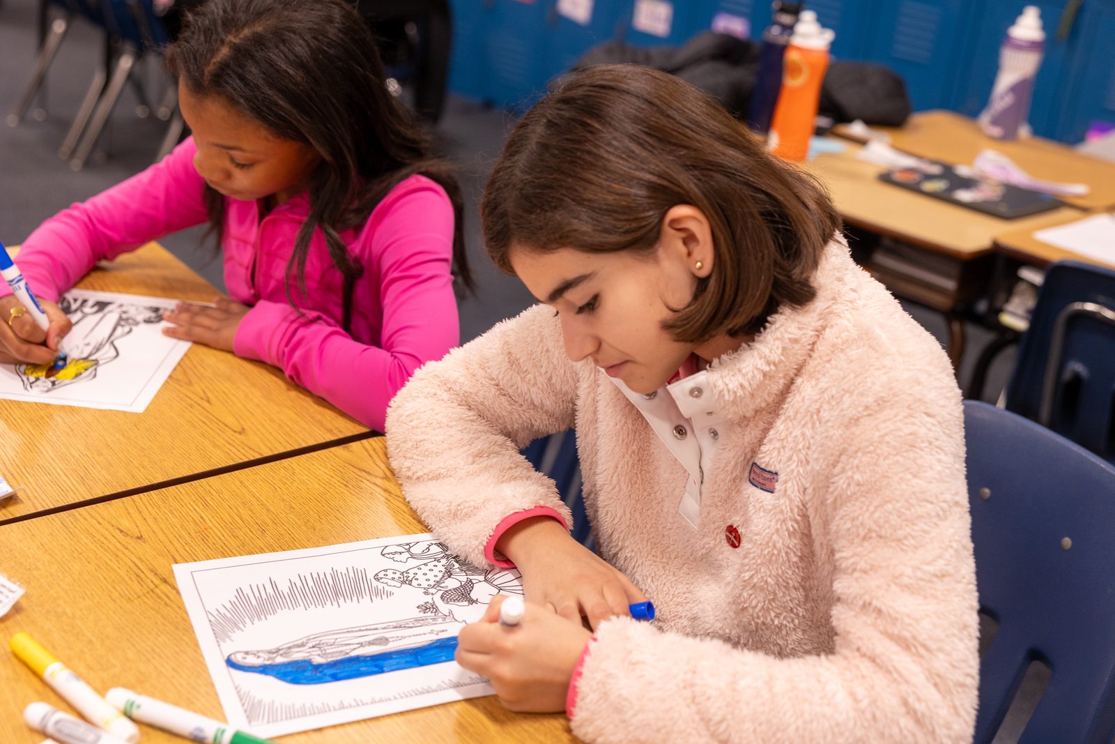 During the Pilgrimage of Hope event at Our Lady of Victory School in Washington on Jan. 31, 2025, seventh grader Lucia Carbajal and sixth grader Mariah Byrd color a picture of Our Lady of Fatima during a pilgrimage to the fifth grade classroom. The Catholic Schools Week event at Our Lady of Victory School was held in conjunction with the 2025 Jubilee Year in the Catholic Church, which has “Pilgrims of Hope” as its theme. (Catholic Standard photo by Mihoko Owada)