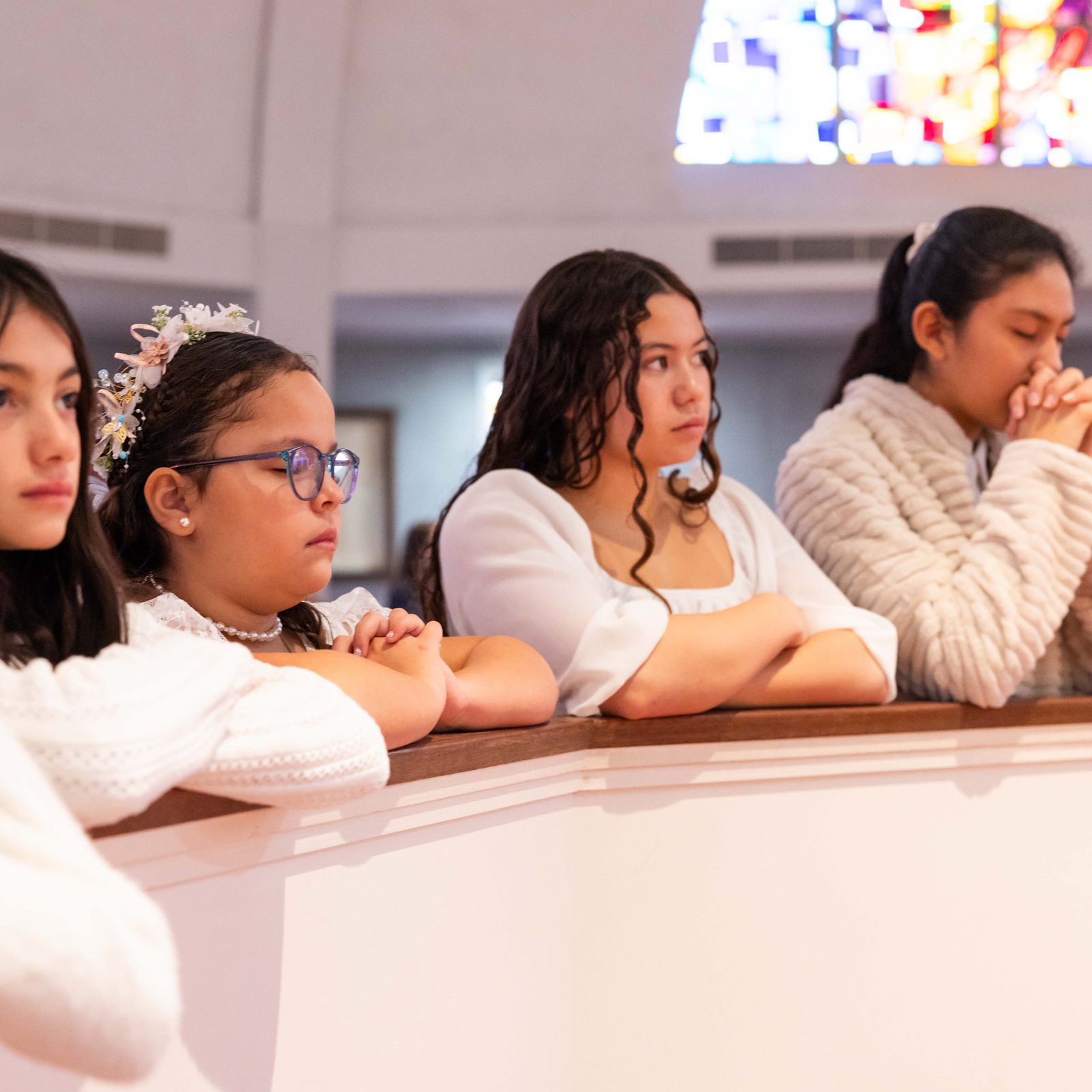 During a Jan. 31 Mass at St. Mary’s Church in Rockville, Maryland, the 12 students from St. Mary’s School who received their First Holy Communion at the Mass included, from left to right, Sophie Durandal, a fifth grader; Isabelle Salvado, a fourth grader; Mariangel Figueroa Parra, a fourth grader; Alyssa Robinson, a seventh grader; and Chelsea Hermenegildo, a seventh grader. (Catholic Standard photo by Andrew Biraj)