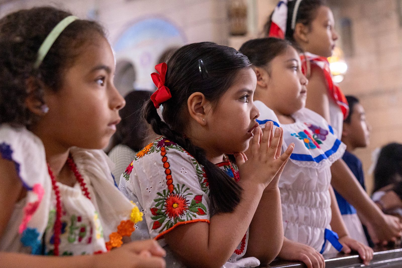 Students from Sacred Heart Catholic School in Washington participate in a Sept. 20 Mass celebrated by Cardinal Wilton Gregory at the Shrine of the Sacred Heart to mark National Hispanic Heritage Month. (Catholic Standard photos by Mihoko Owada)