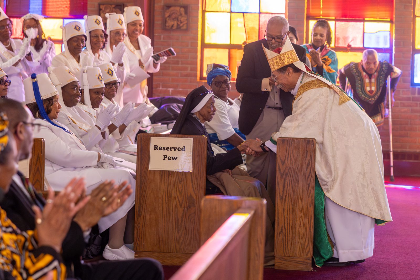 Washington Auxiliary Bishop Roy Campbell Jr. greets Sister Magdala Marie Gilbert, an Oblate Sister of Providence, during a Mass at the Church of the Incarnation in Washington, D.C., on Feb. 22, 2025 marking Black History Month. The annual Mass is sponsored by the Office of Cultural Diversity and Outreach of The Roman Catholic Archdiocese of Washington. (Catholic Standard photo by Mihoko Owada)