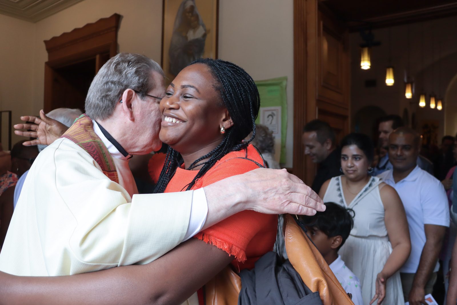 People congratulate Father Michael Kelley, the longtime pastor of St. Martin of Tours Catholic Church in Washington, D.C., after he celebrated a Mass on May 18, 2025 marking his 50th anniversary as a priest. (Catholic Standard photos by Javier Diaz)