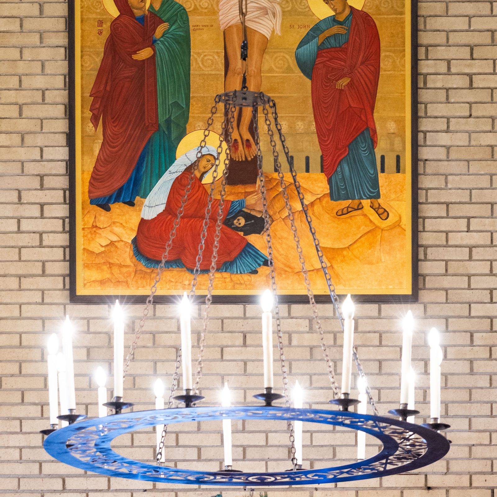 A new icon of the crucifixion by artist Delphia Dirks that hangs above the main entrance at St. Hugh of Grenoble Church in Greenbelt, Maryland, was blessed by Washington Cardinal Robert W. McElroy during a Dec. 14 Mass there. (Catholic Standard photo by Andrew Biraj)