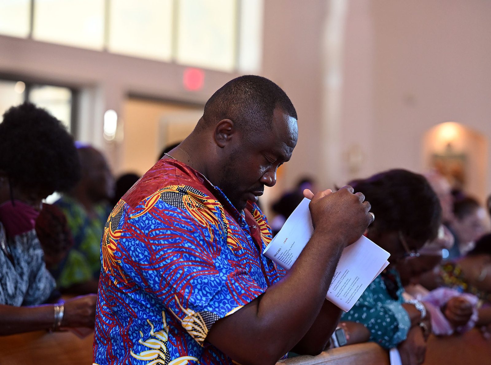 A man prays during the Africa Day Mass on Aug. 20 at Mother Seton Church in Germantown. (Catholic Standard photo by Leslie Kossoff)