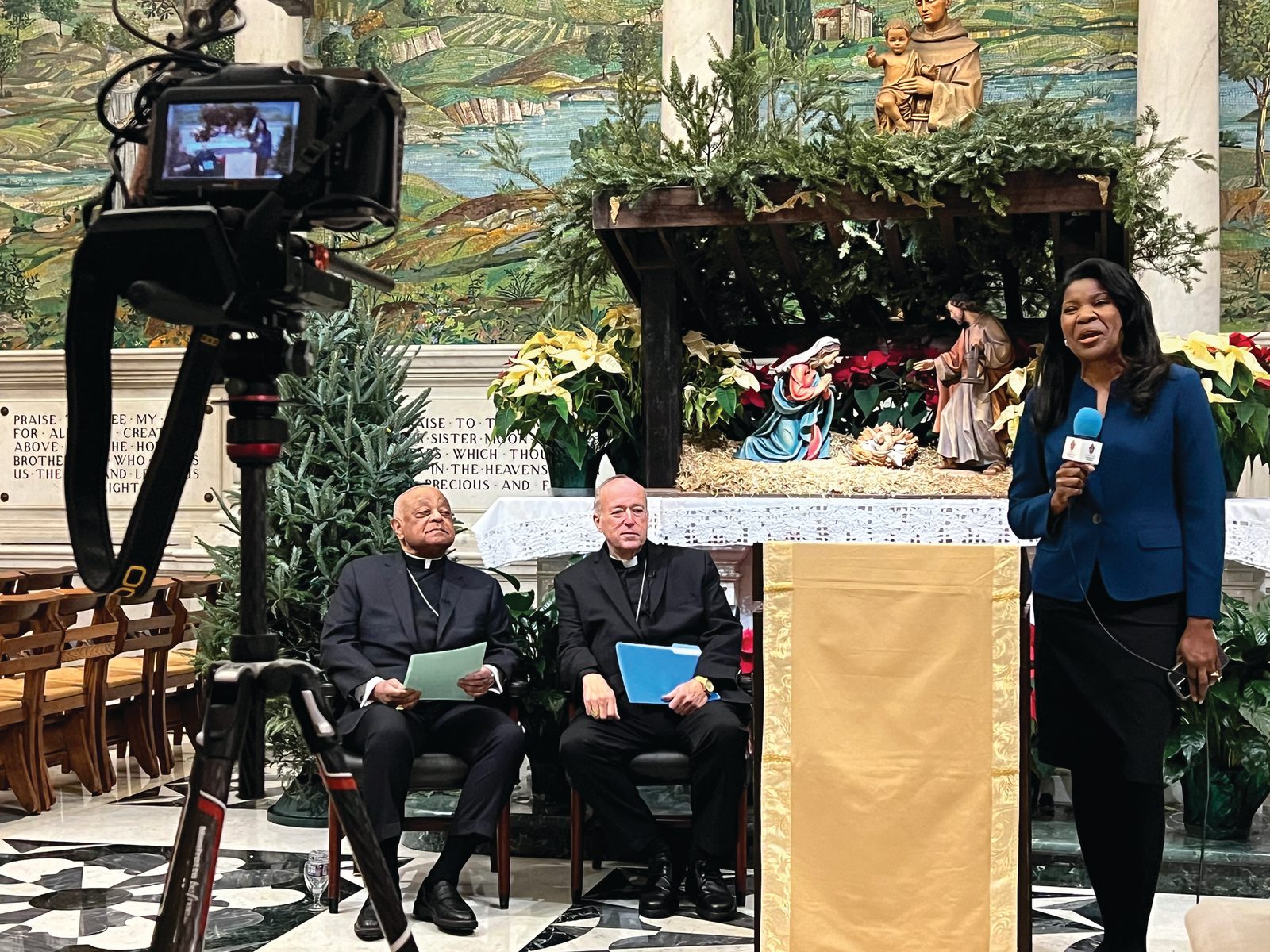 At right, Paula Gwynn Grant, the Secretary for Communications for the Roman Catholic Archdiocese of Washington, speaks at the beginning of a Jan. 6, 2025 press conference at the Cathedral of St. Matthew the Apostle in Washington, where Cardinal Wilton Gregory, at left, and Cardinal Robert McElroy, at center, spoke. That morning, Pope Francis named Cardinal McElroy, the bishop of the Diocese of San Diego, as the new archbishop of Washington, succeeding Cardinal Gregory, who served in that role since 2019. On Jan. 6, Pope Francis also accepted the resignation of Cardinal Gregory as the archbishop of Washington. As required by Church law, Cardinal Gregory had submitted his resignation to the pope two years ago after he turned 75 on Dec. 7, 2022. (Photo by Geoffrey Ros/The Roman Catholic Archdiocese of Washington)