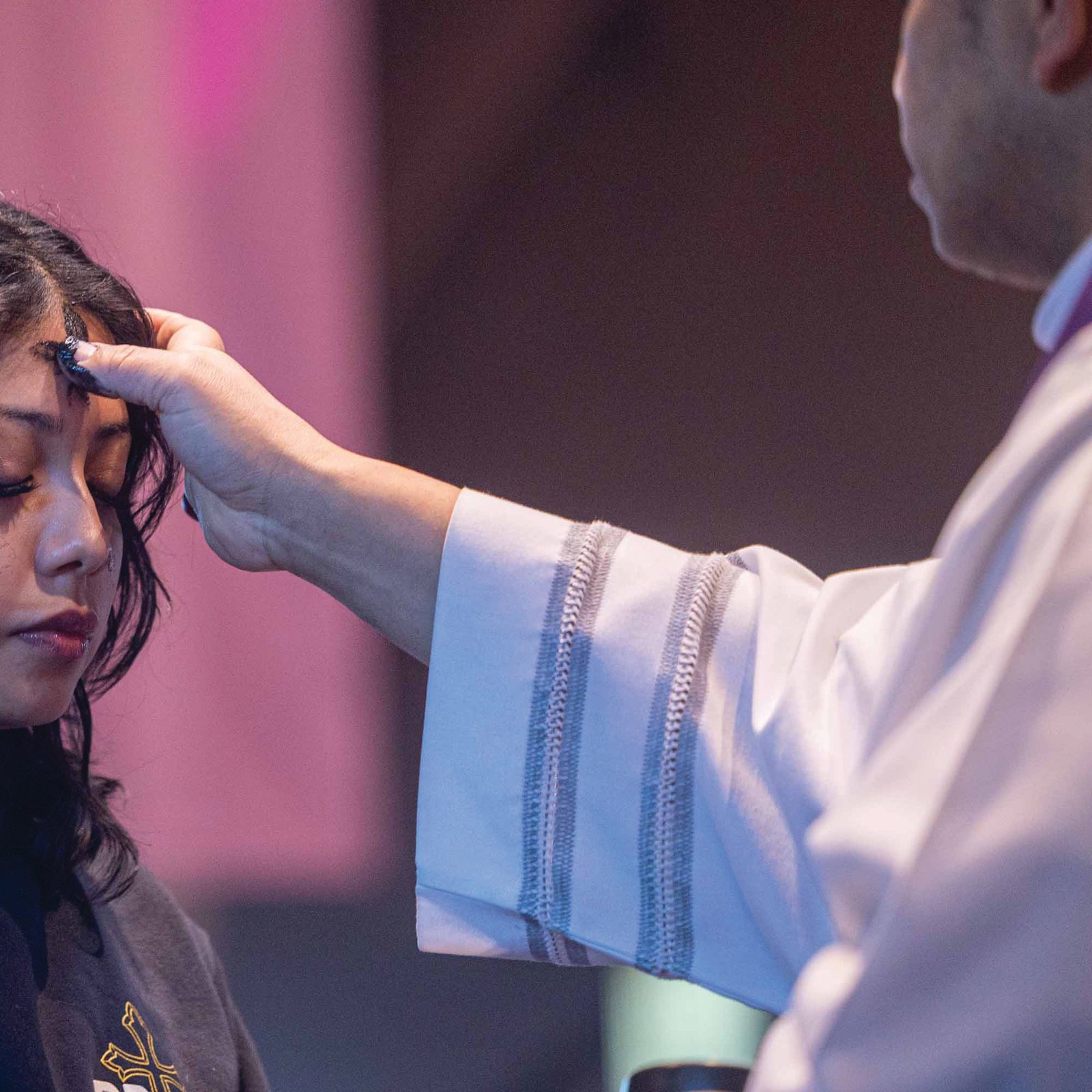 During an Ash Wednesday Mass on Feb. 18 at Our Lady of Sorrows Church in Takoma Park for students from Don Bosco Cristo Rey High School, Father Angel Fermin, the pastor of Our Lady of Sorrows, places ashes on the forehead of student Katherine Yahuitl-Herrara. (Catholic Standard photo by Mihoko Owada)