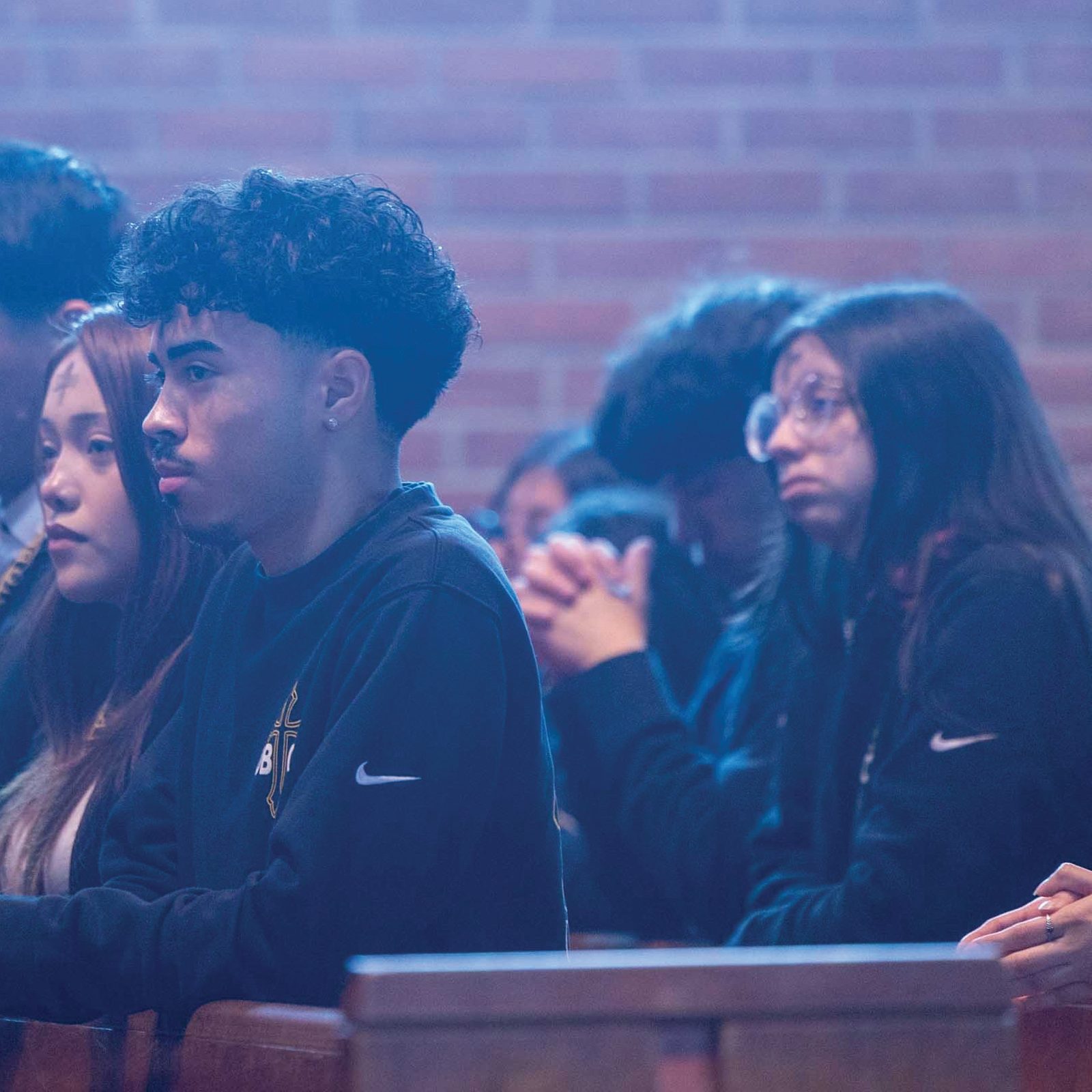 Students from Don Bosco Cristo Rey High School in Takoma Park, Maryland, including from left to right, Angie Tejada, Martin Ferrufino, Chelsea Mendoza, Jaden Campos and  Adaani Fernandez, attend an Ash Wednesday Mass on Feb. 18, 2026 at Our Lady of Sorrows Church, which is next-door to the school. (Catholic Standard photo by Mihoko Owada)