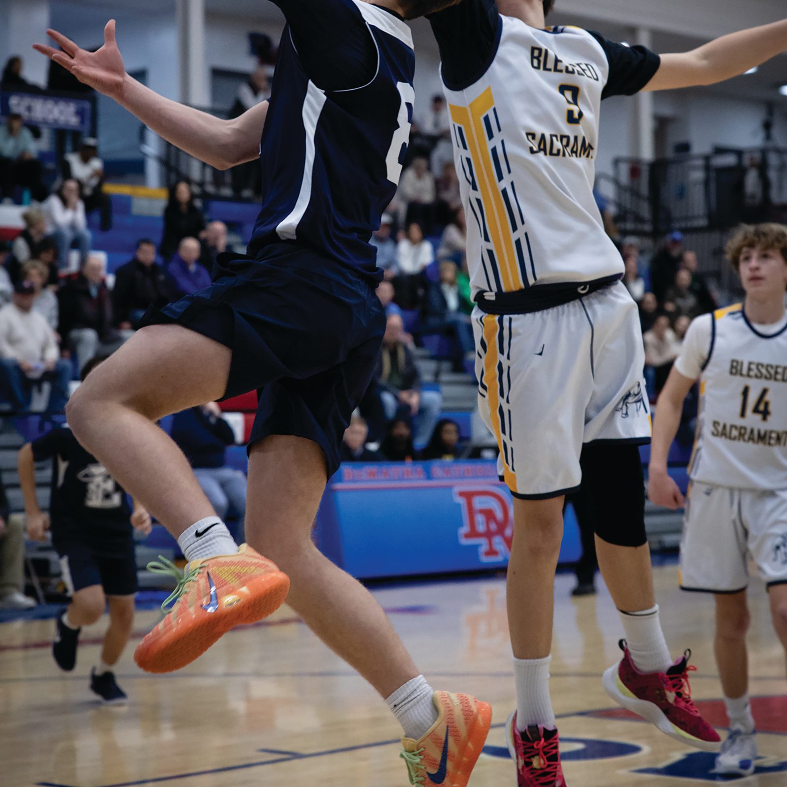 William Luecking (#81) of St. Elizabeth’s of Rockville drives for a basketball while being defended by Colin Cleary (#3) from Blessed Sacrament during the boys’ basketball CYO 14U championship game on Feb. 17 at DeMatha Catholic High School in Hyattsville. The team from Blessed Sacrament Parish in Washington defeated St. Elizabeth’s, 49-36. (Catholic Standard photo by Christopher Newkumet)