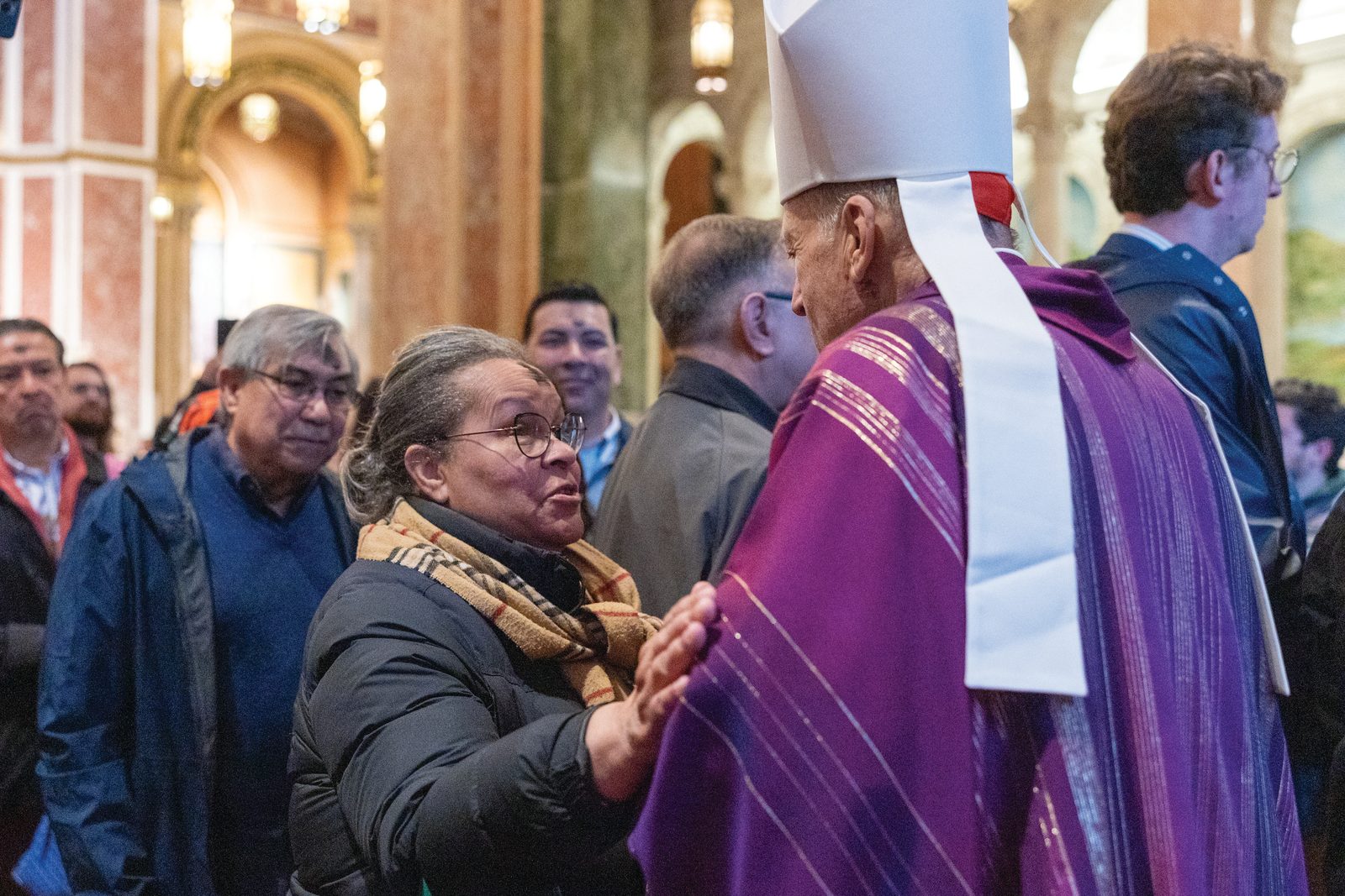 Cardinal Robert McElroy greets the faithful after celebrating a March 5 Ash Wednesday Mass at the Cathedral of St. Matthew the Apostle. About 1,000 people attended the Mass. (Catholic Standard Photo by Mihoko Owada)