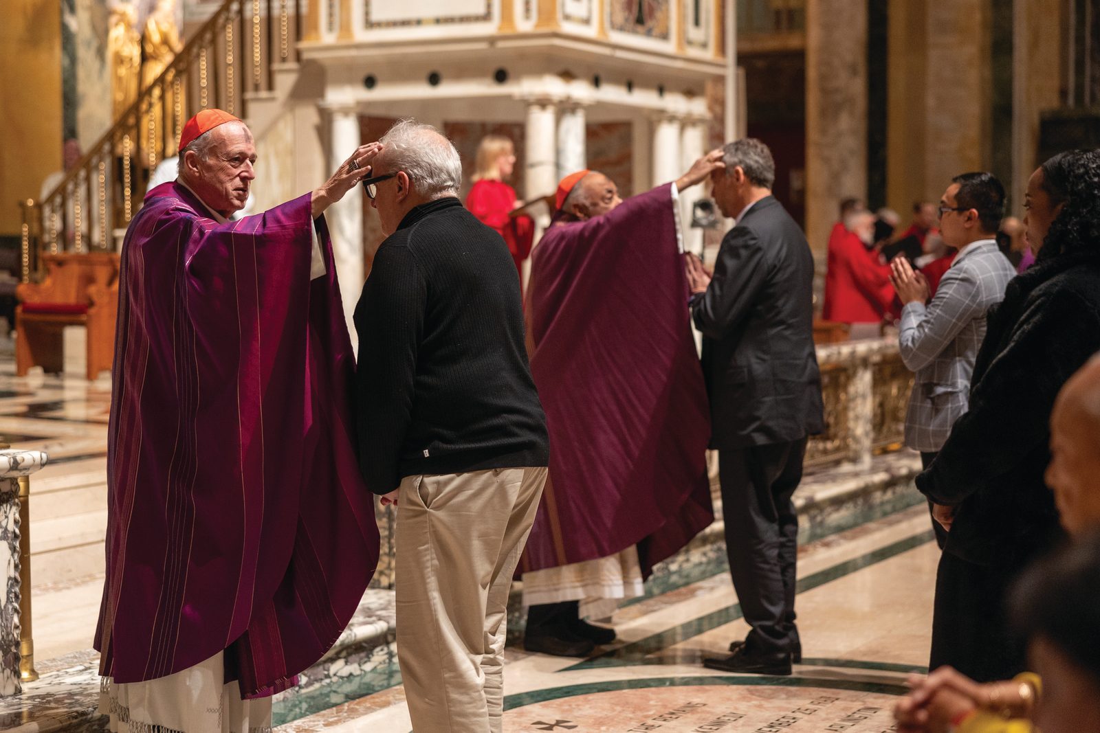 Cardinal Robert McElroy (at left) and Cardinal Wilton Gregory dispense ashes during a March 5 Ash Wednesday Mass at the Cathedral of St. Matthew the Apostle. (Catholic Standard Photo by Mihoko Owada)
