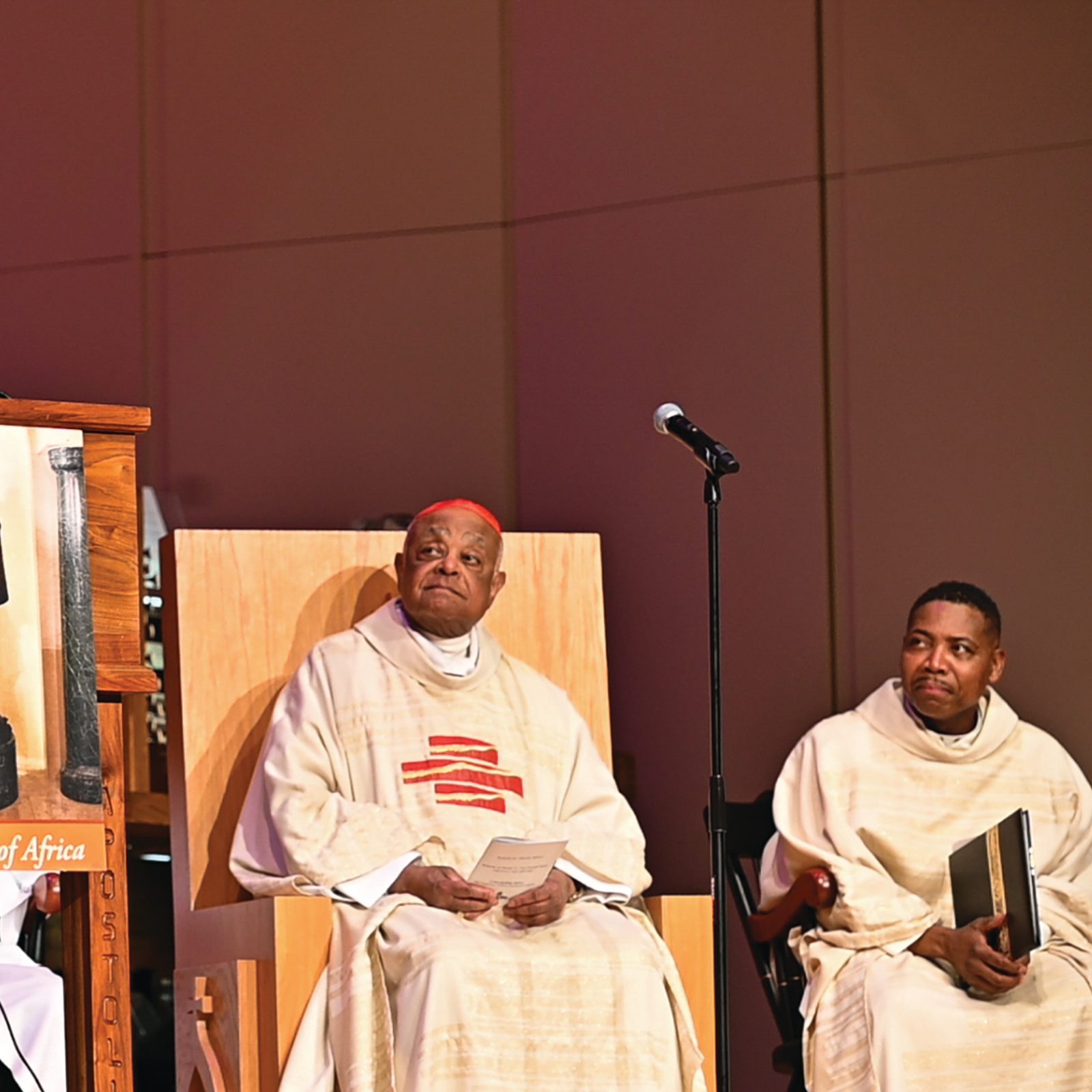 From left, Reverend Dr. Lawrence Edward Carter Sr., professor and founding dean at Morehouse College's Martin Luther King International Chapel; Cardinal Wilton Gregory and Father Urey Mark, chaplain of Lyke House Catholic Center, are photographed during a service honoring the Shriver-Kennedy family at the chapel Feb. 13. (Photo by Julianna Leopold of the Georgia Bulletin newspaper of the Archdiocese of Atlanta)