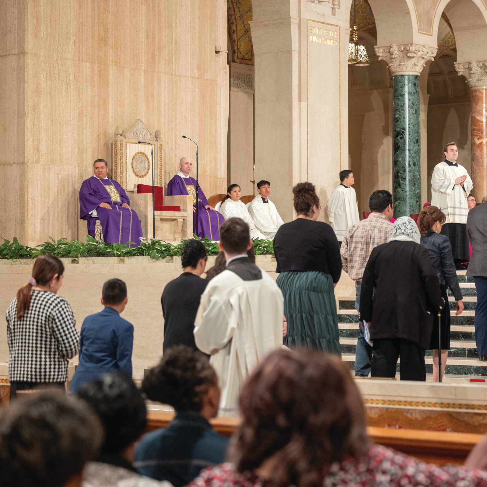 Above and below, Cardinal Robert W. McElroy greets catechumens and their godparents during the March 16, 2025 Rite of Election and Call to Continuing Conversion at the Basilica of the National Shrine of the Immaculate Conception. Catechumens are those who have never been baptized and who will at this year’s Easter Vigil receive the sacraments of Baptism, Confirmation, and Communion. (Catholic Standard photos by Mihoko Owada)