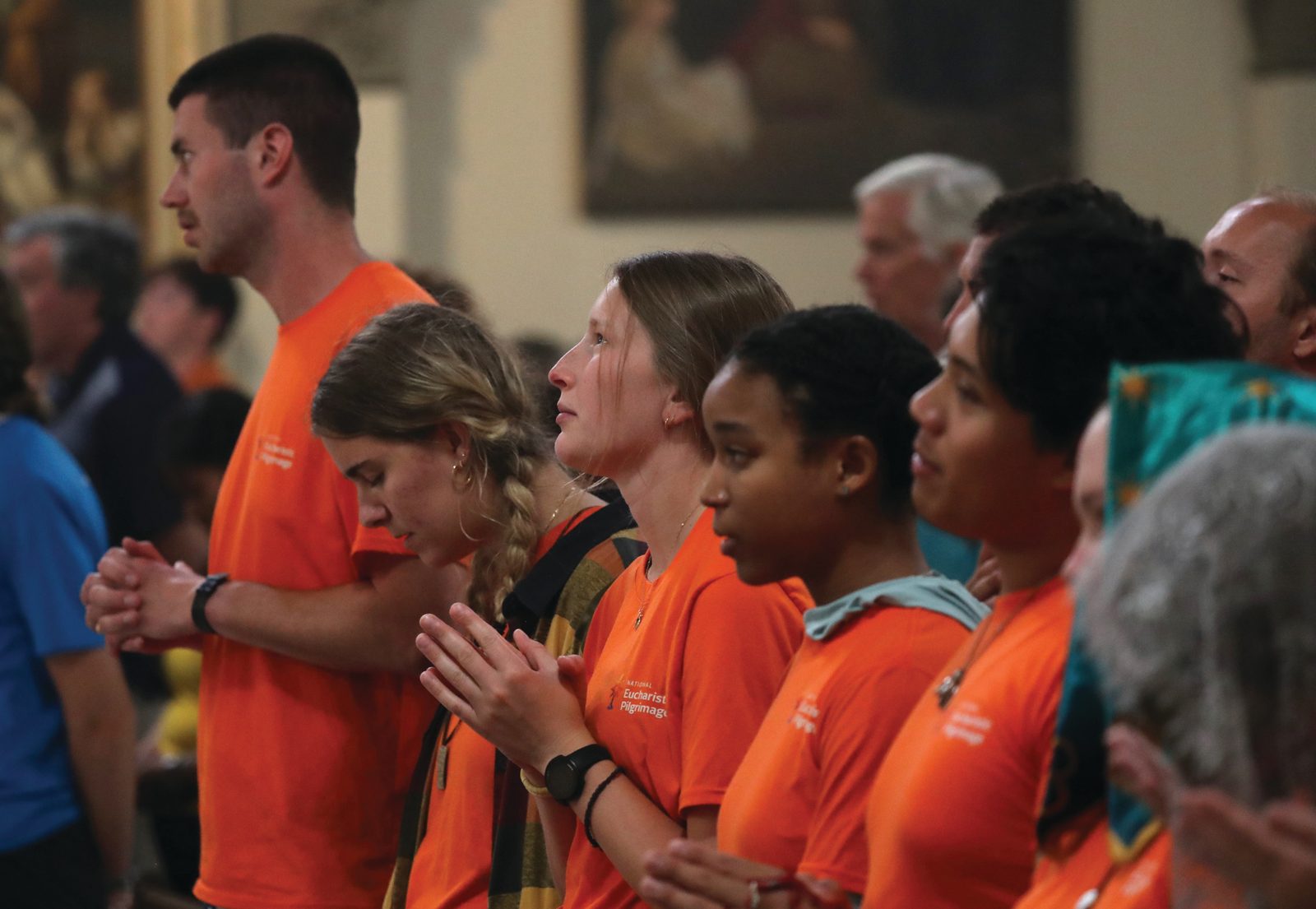 Pilgrims pray during a Mass at St. John the Evangelist Church in Indianapolis July 16, 2024, just ahead of the National Eucharistic Congress. (OSV News photo/Bob Roller)