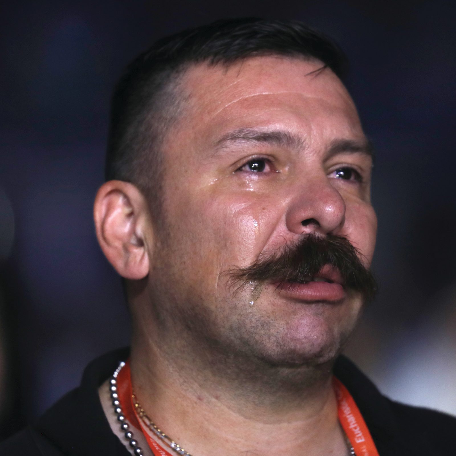 Above and below, pilgrims become emotional during Eucharistic adoration at the opening revival night July 17, 2024, of the National Eucharistic Congress at Lucas Oil Stadium in Indianapolis. (OSV News photo/Bob Roller)