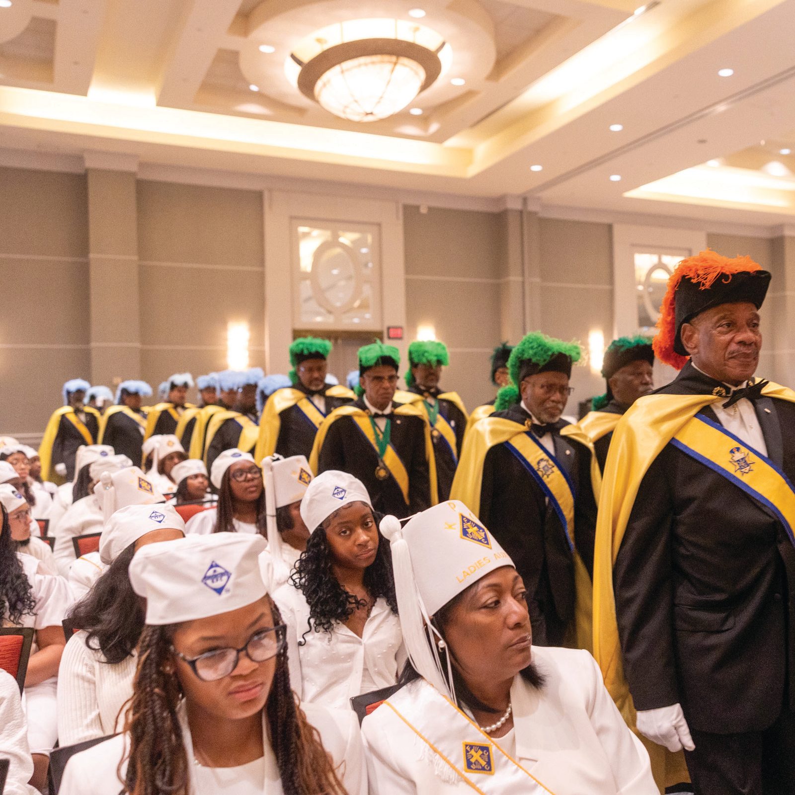 Above, members of the Knights of Peter Claver process into a July 20 Mass celebrated by Archbishop Timothy Broglio, archbishop of the Archdiocese for the Military Services, USA, and president of the U.S. Conference of Catholic Bishops, to open the fraternal organization’s 109th annual Senior National Convention. Below, members of the Knights of Peter Claver’s Ladies Auxiliary participate in the Mass. (CSS photos by Mihoko Owada)