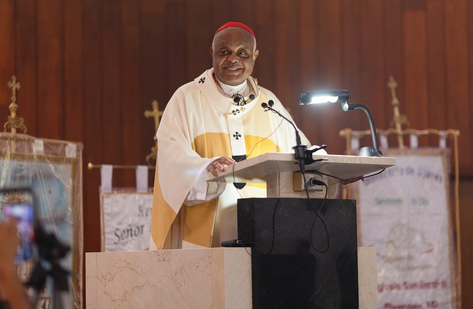 Cardinal Wilton Gregory delivers the homily during an Aug. 17 Mass he celebrated to Mark the 75th anniversary of St. Bernard of Clairvaux Parish in Riverdale Park, Maryland. During the homily – which he delivered in English and Spanish – he praised the parishioners for their “spirit of unity.” (Catholic Standard photo by Rachel Lincoln)