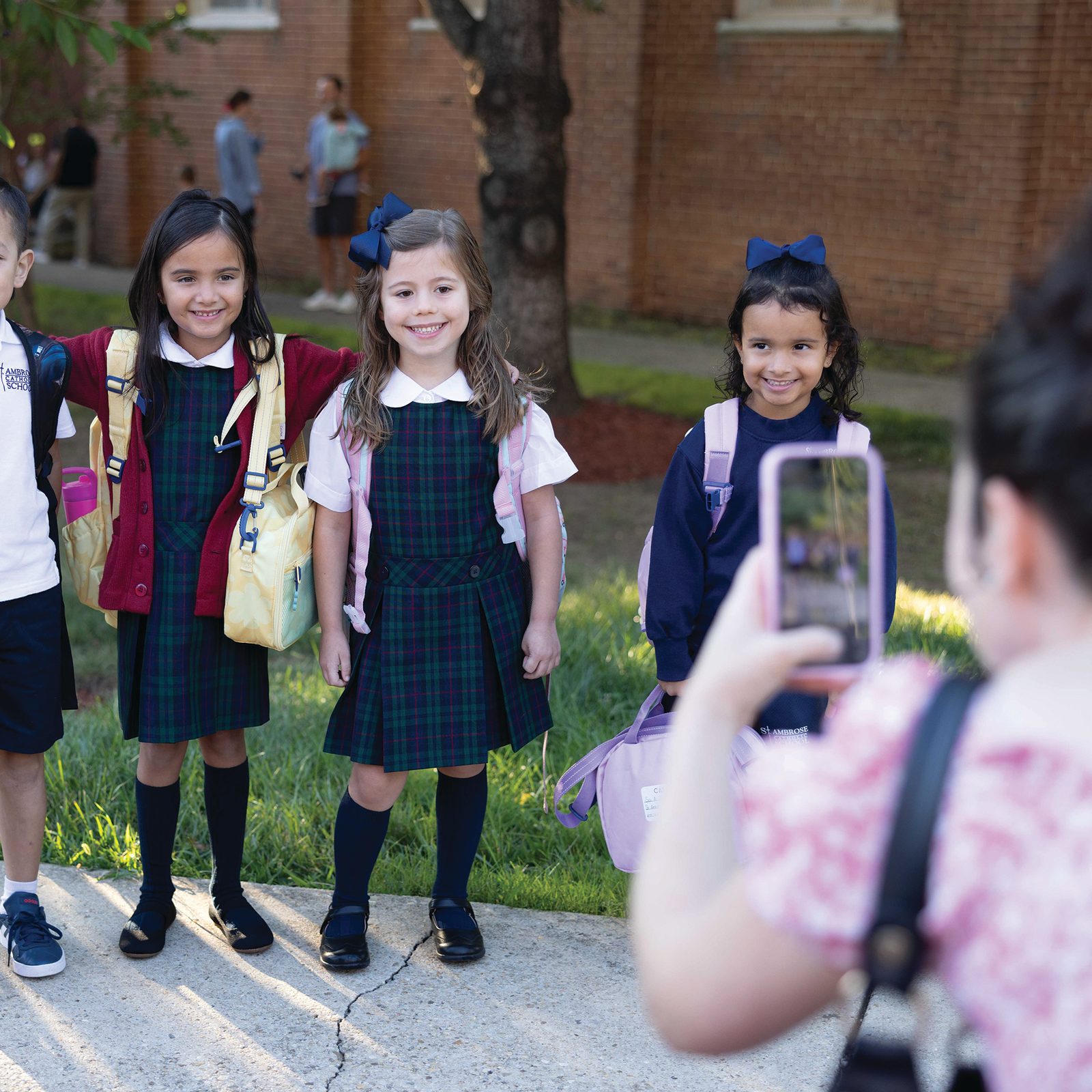 Students at St. Ambrose School in Cheverly, Maryland, pose for photos on the first day of classes there, Aug. 26, 2025. (Catholic Standard photo by Andrew Biraj)