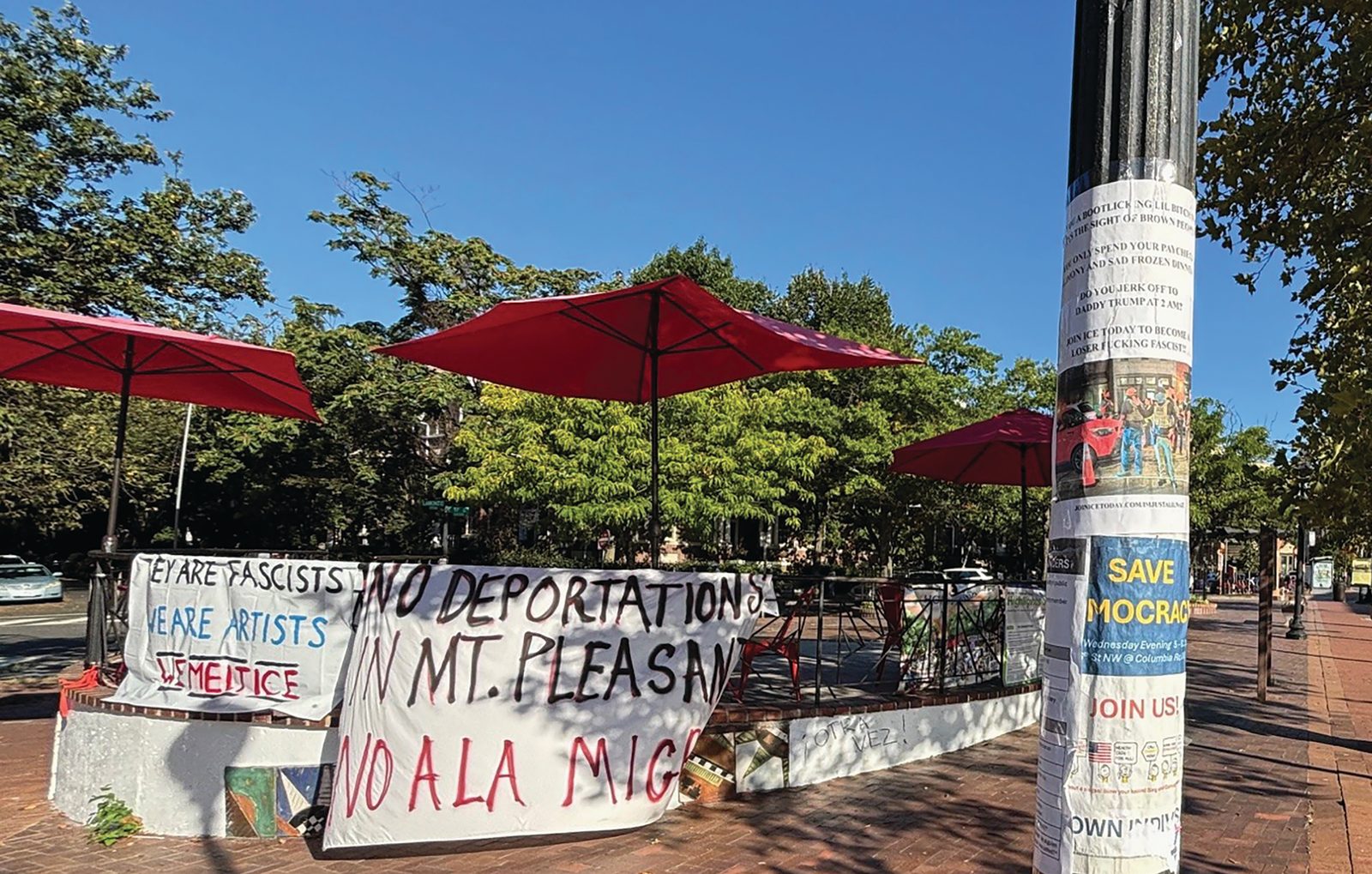 The streets of the predominantly Hispanic neighborhood of Mt. Pleasant in Washington, D.C. look empty, but its signs show disapproval of immigration raids. (El Pregonero photo by Miguel Vivanco)