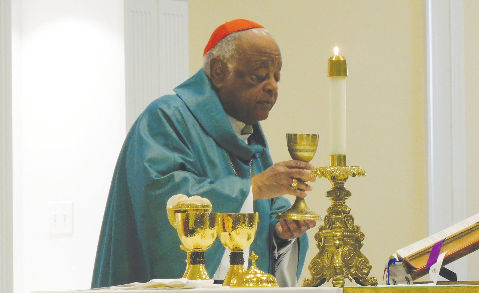 Cardinal Wilton Gregory celebrates a Sept. 8 Mass at the University of Maryland’s Catholic Student Center in College Park, Maryland. He asked those at the Mas to consider what is worse – “the inability of our ears to hear and understand sound, or the deafness of the human spirit to appreciate the needs of our sisters and brothers?” (Photo by Elizabeth Polo)