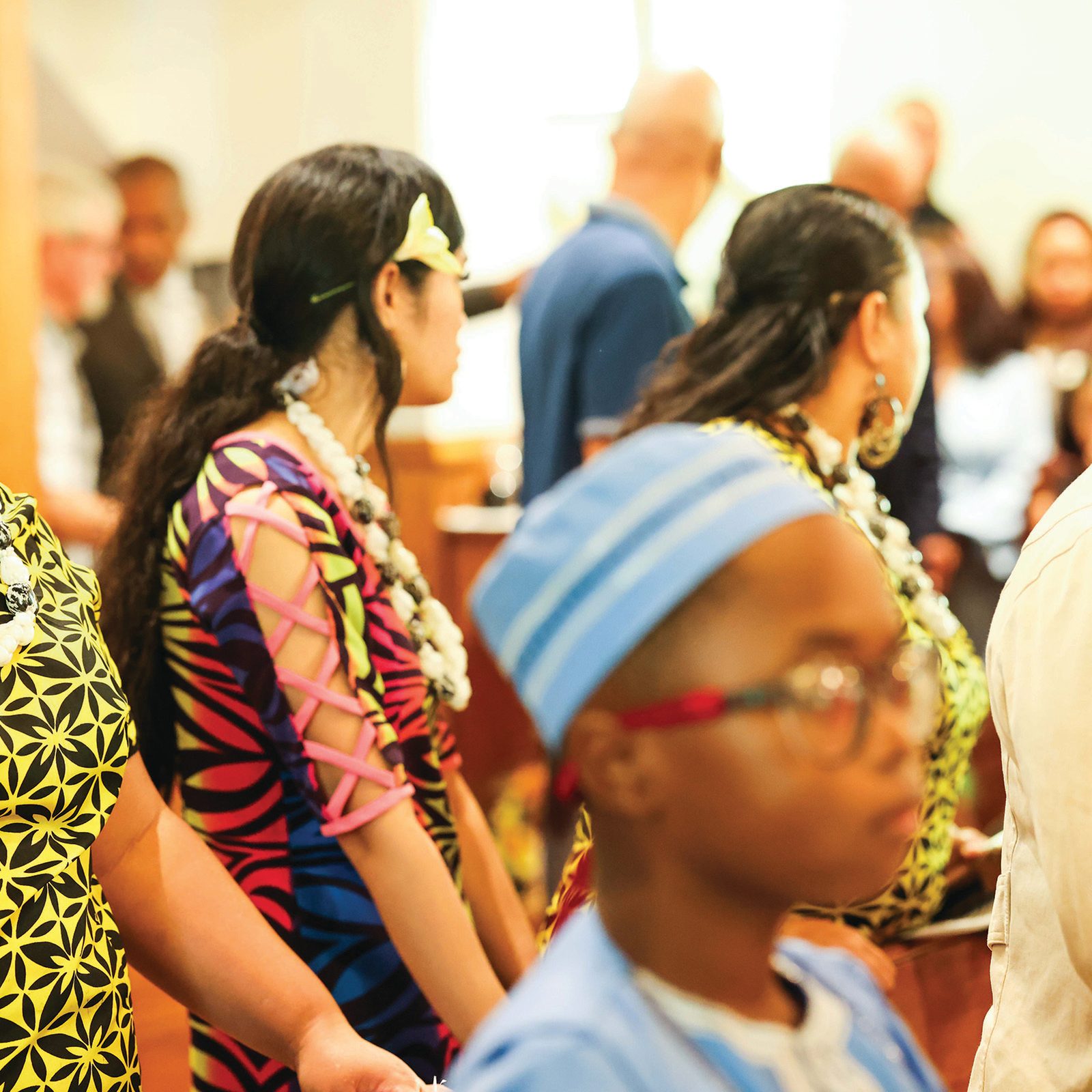 Above and below, parishioners, many in traditional dress, participate the Sept. 8 anniversary Mass. The parish has many parishioners from the Latino, Filipino, Samoan and Cameroonian communities. (Catholic Standard photos by Andrew Biraj)