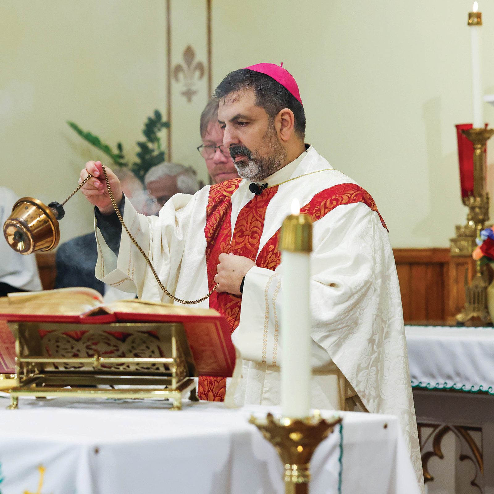 Above, Bishop Juan Esposito celebrates Mass marking the 115th anniversary of St. Mary Star of the Sea Parish in Indian Head, Maryland. Below, Father Brian Coelho, pastor of the parish, speaks during the Mass. (Catholic Standard photos by Andrew Biraj)